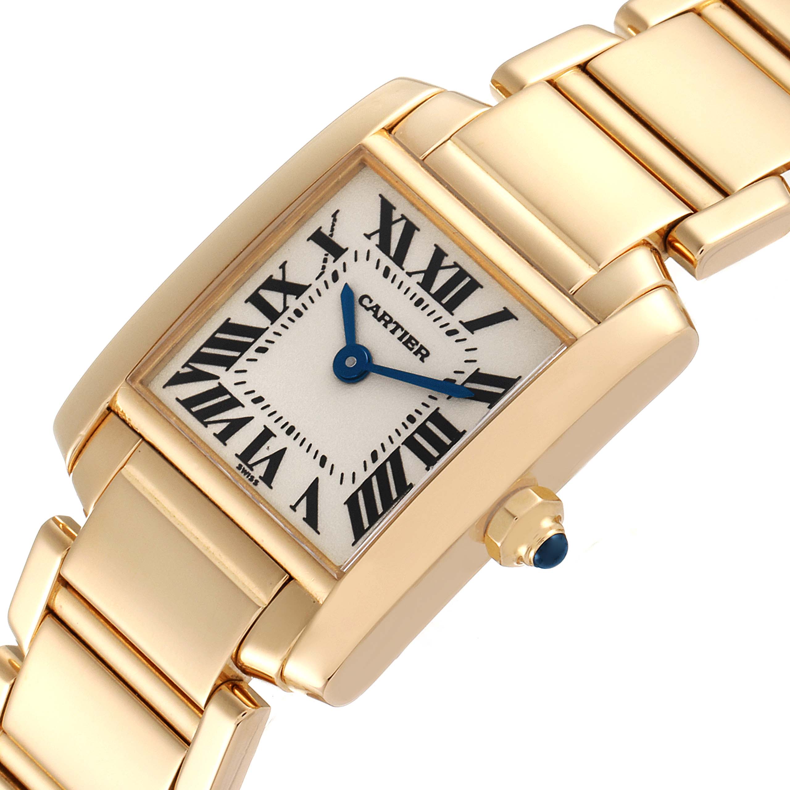 The image shows a Cartier Tank Française watch from a diagonal angle, highlighting its gold case, bracelet, and crown with a blue gemstone.