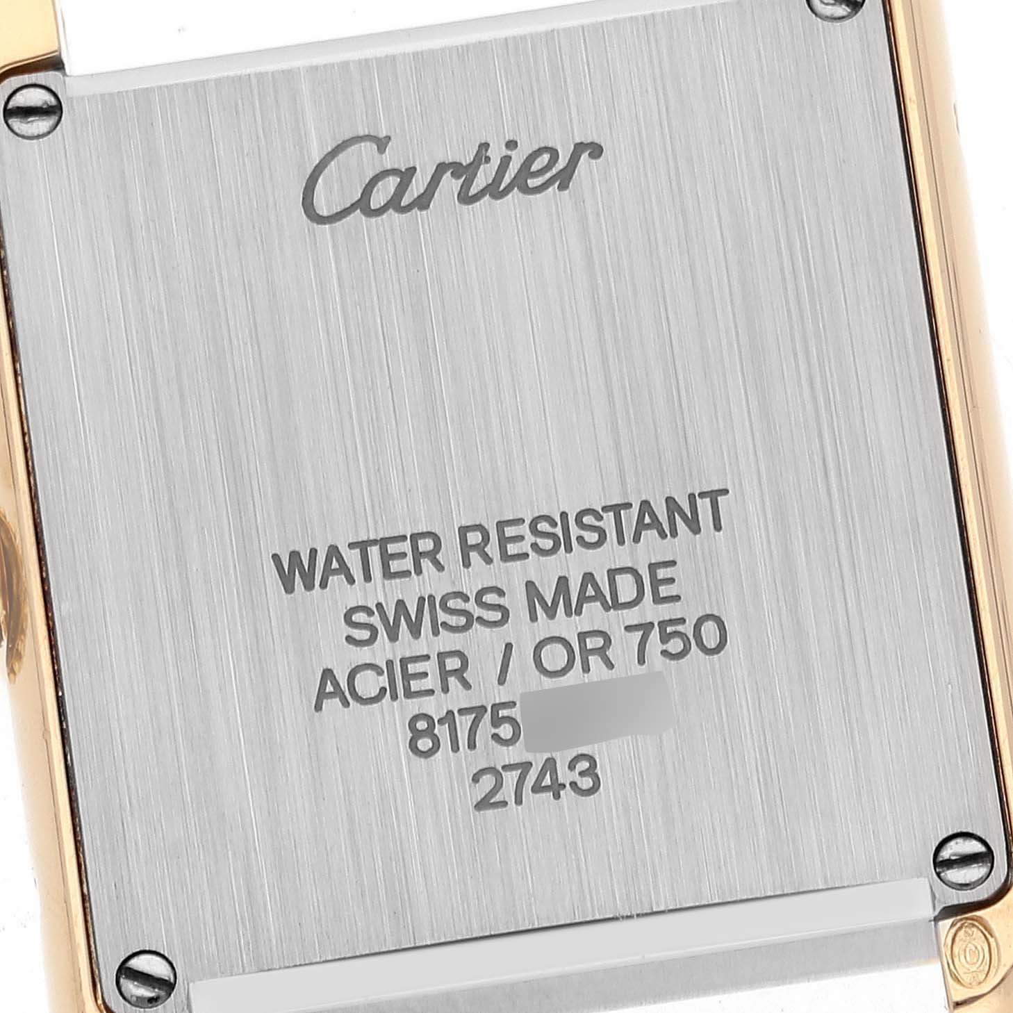 This image shows the back case of a Cartier Tank Solo W1018755 Women
s Steel and Gold (two tone) Silver Dial W1018755 Women
s Steel and Gold (two tone) Silver Dial watch, highlighting the brand, model, and specifications.