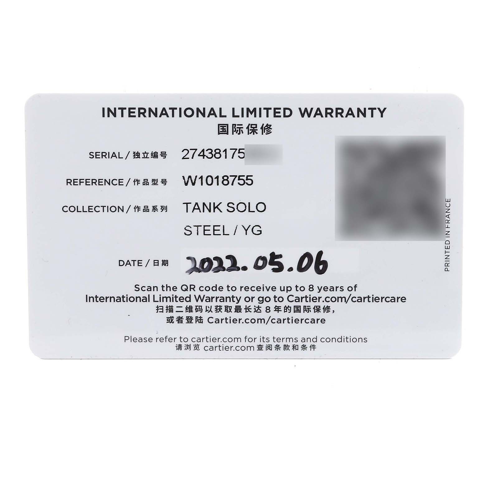 The Tank Solo model by Cartier is shown via its international limited warranty card.