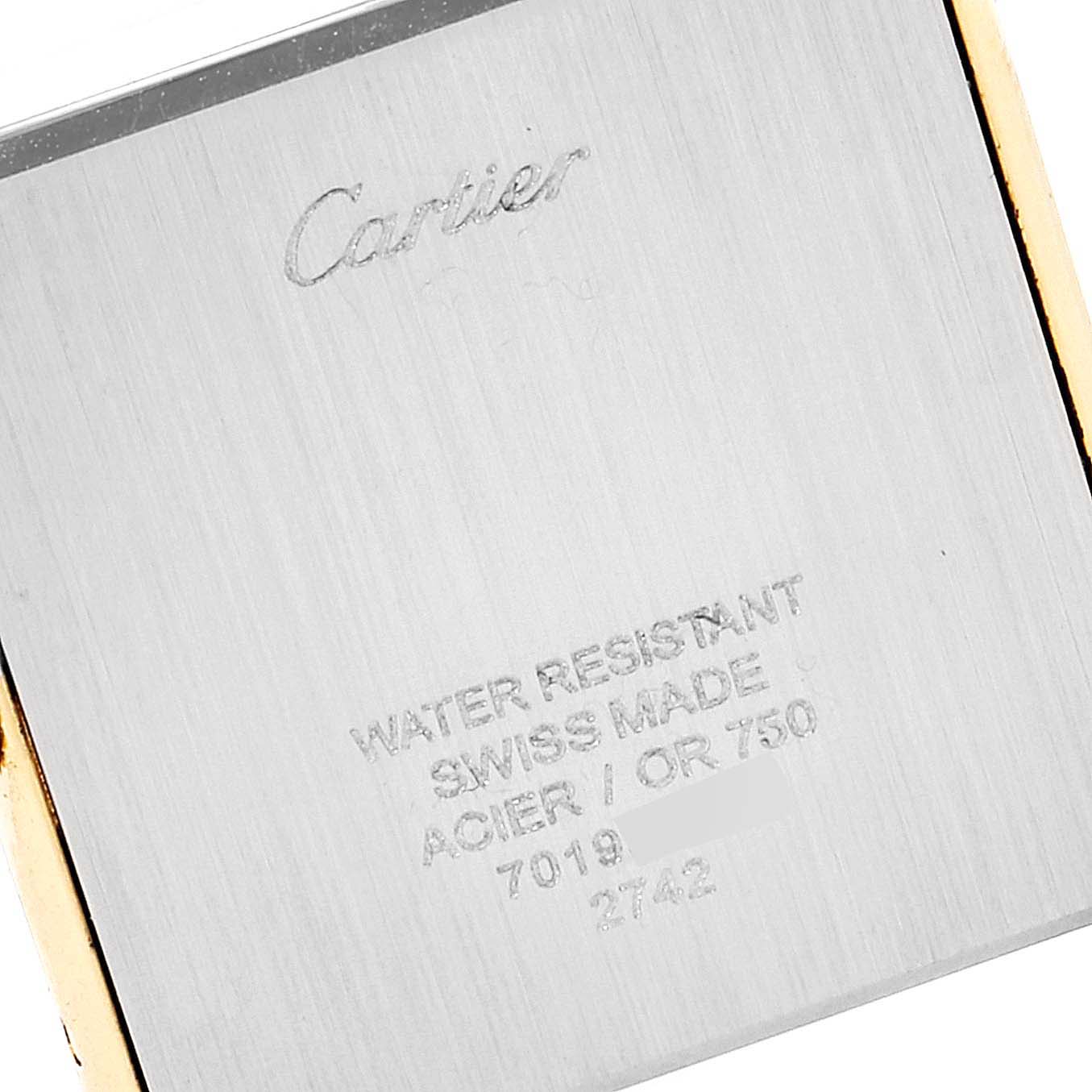 The image shows the back case of the Cartier Tank Solo W1018855 Men's Yellow Gold Silver Dial W1018855 Men's Yellow Gold Silver Dial watch, displaying engravings including the brand, model, and material details.