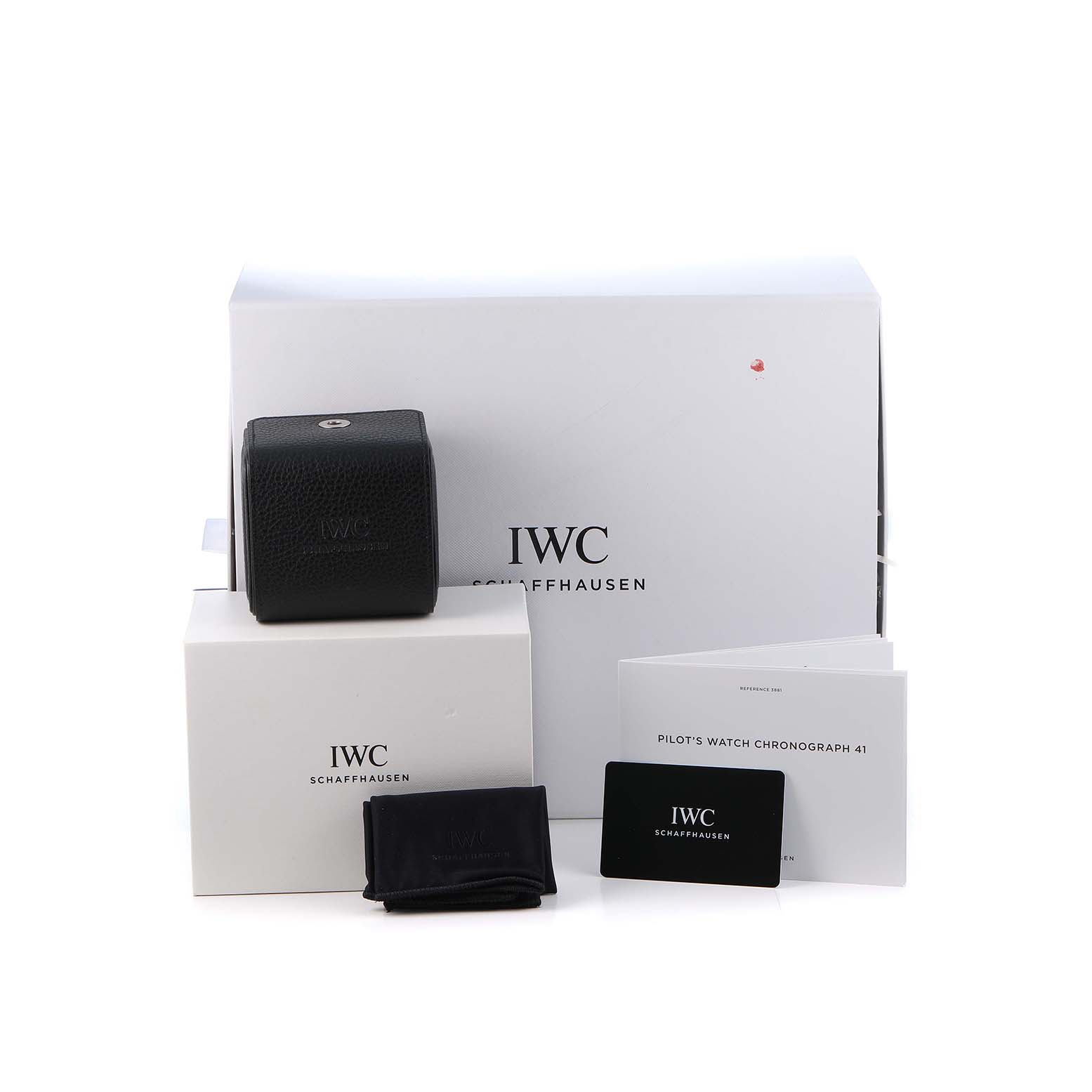 The image shows IWC Pilot IW506003 Men's Ceramic Brown Dial's Watch accessories, including boxes, a case, cloth, booklet, and a warranty card from a front angle.