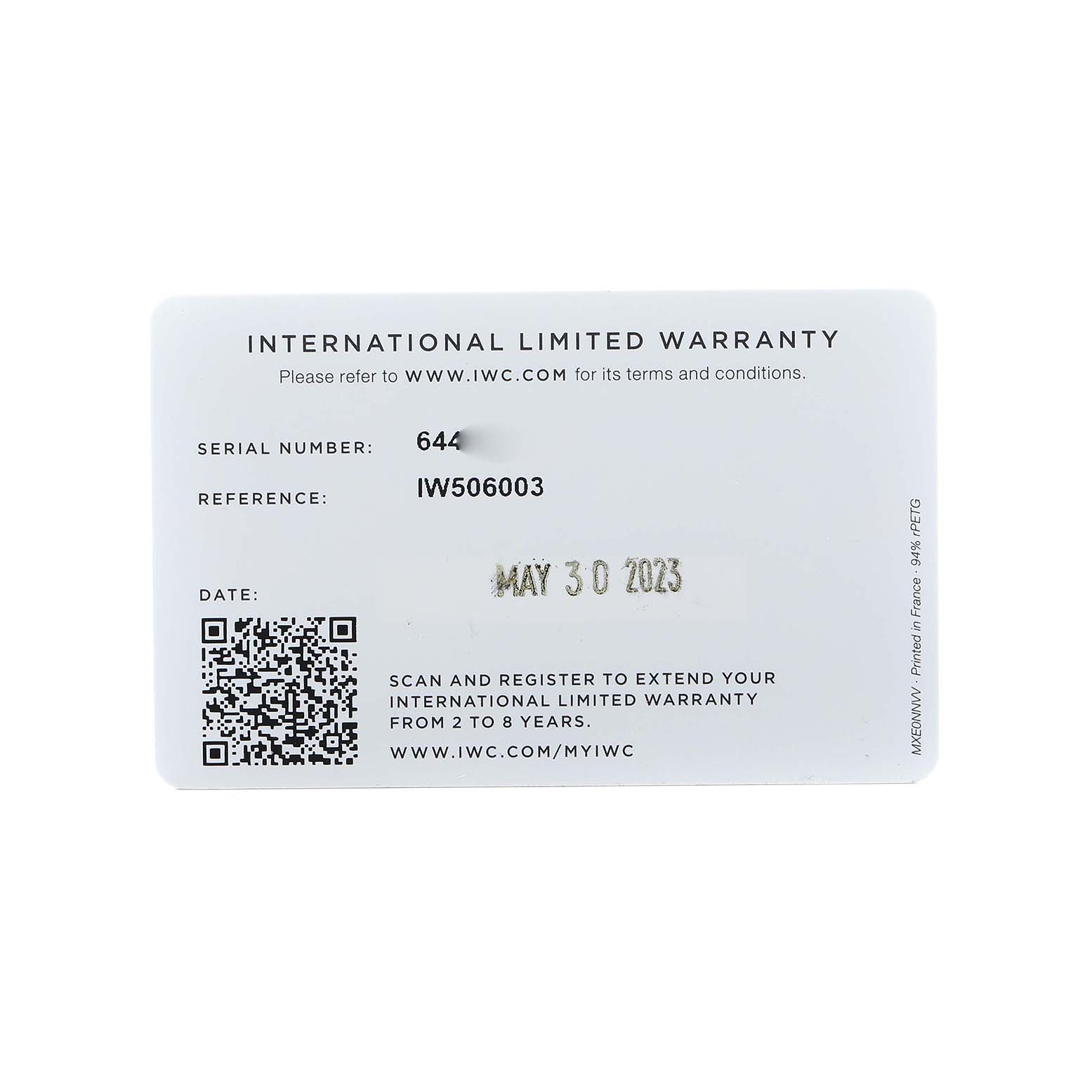 This image shows an IWC Pilot IW506003 Men's Ceramic Brown Dial watch's International Limited Warranty card from a top-down angle.