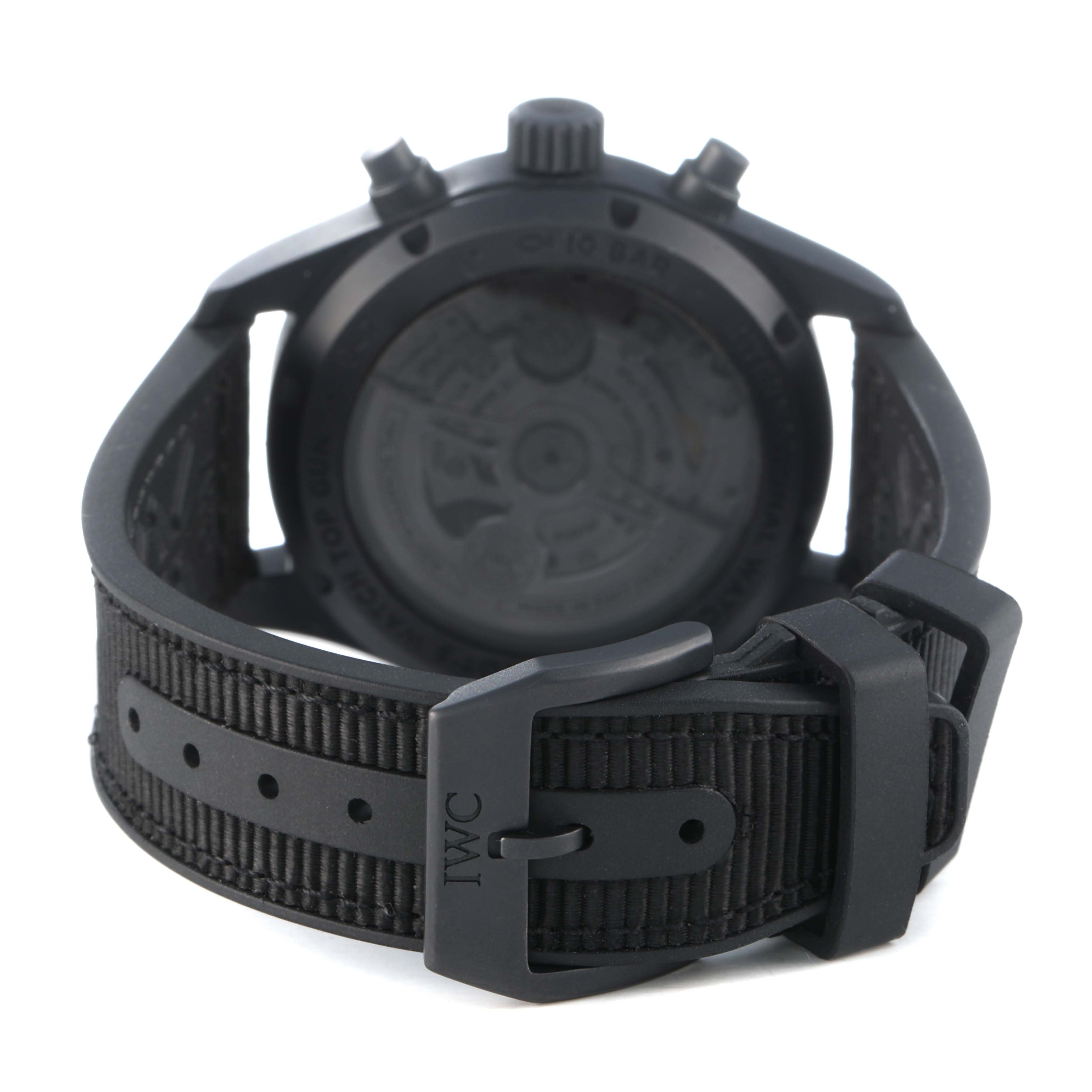 The IWC Pilot IW388106 Men's Ceramic Black Dial model watch is shown from a rear angle, highlighting the buckle, strap, and case back.