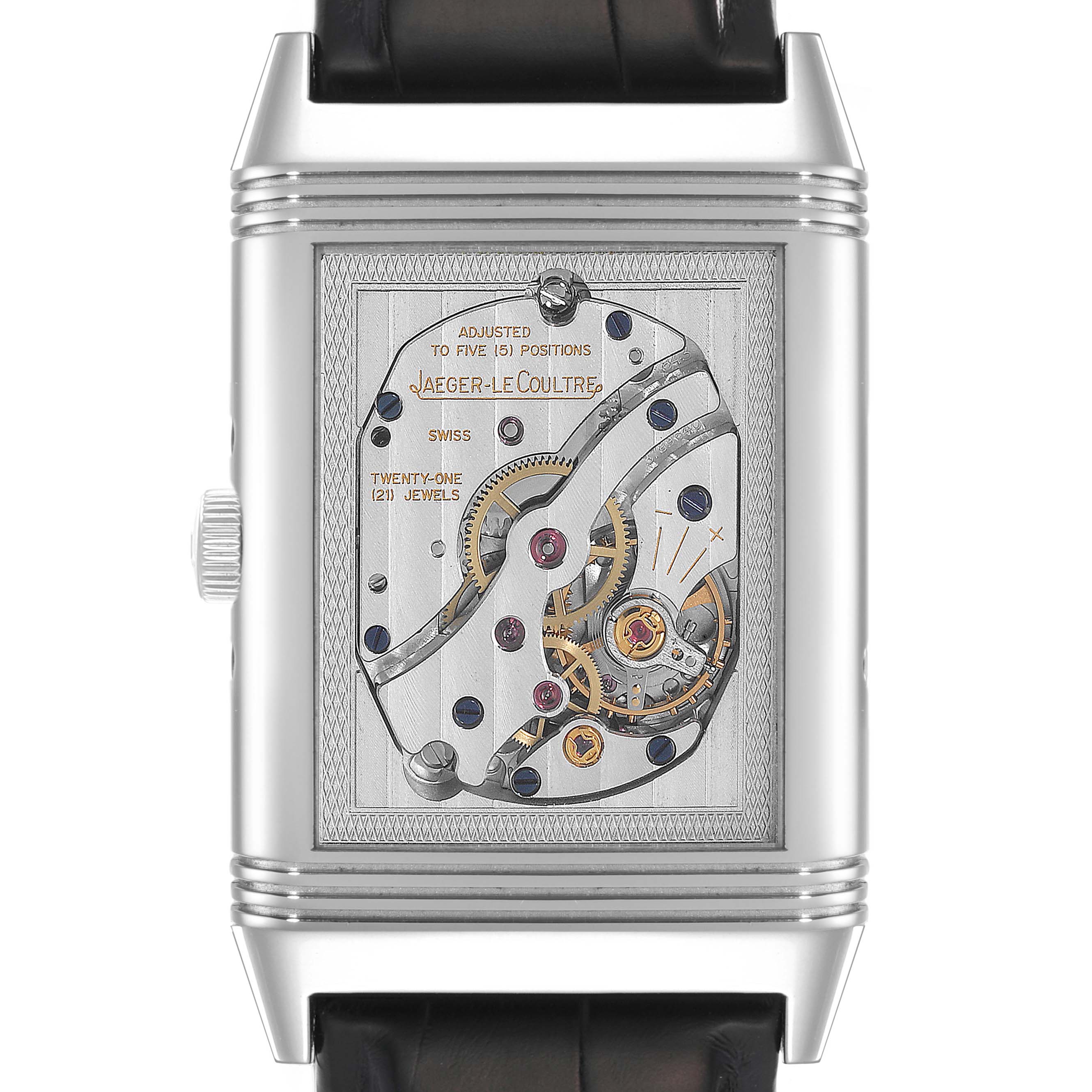 This image shows the back view of a Jaeger-LeCoultre Reverso watch, revealing its mechanical movement and intricate details.