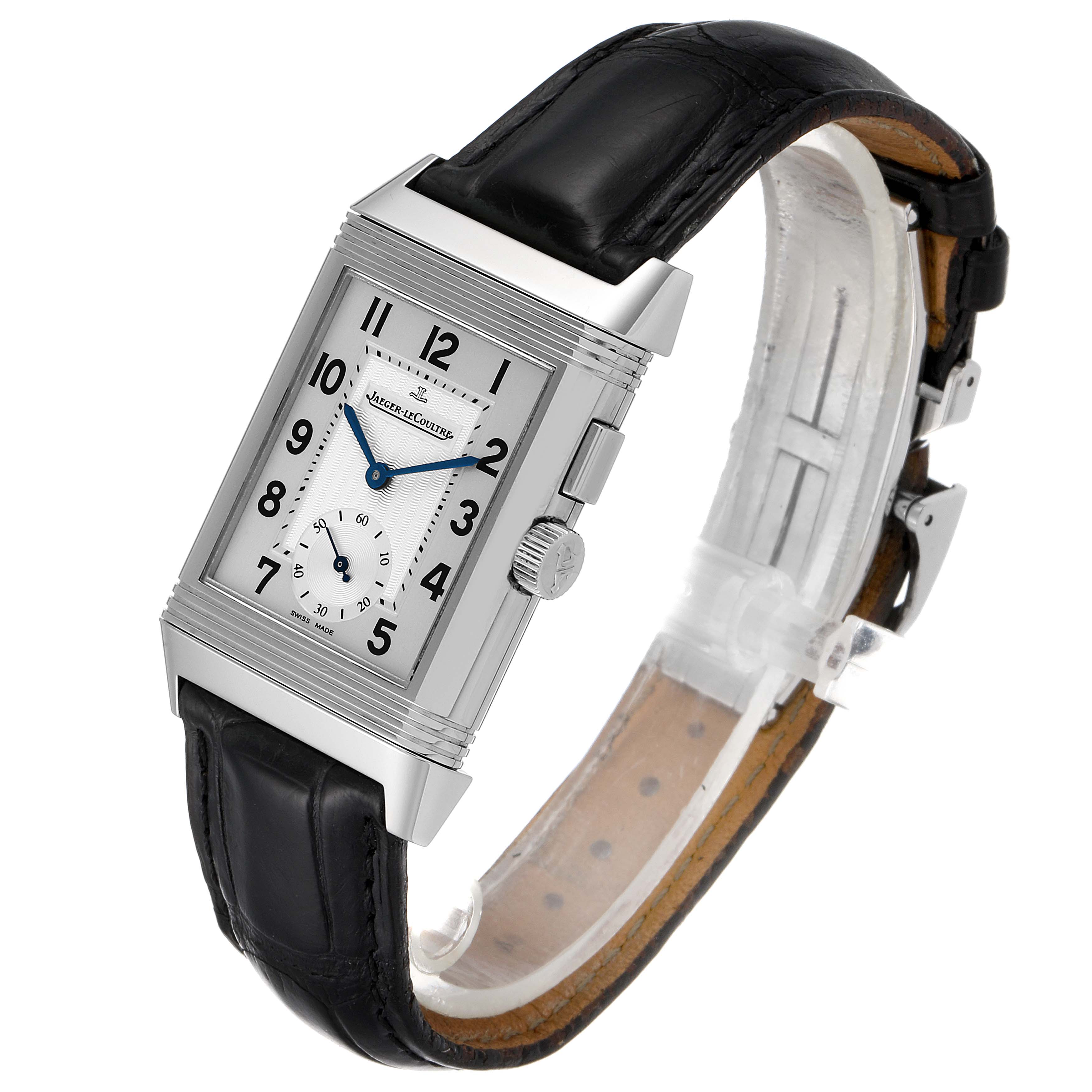 The image shows a Jaeger-LeCoultre Reverso watch angled to display its rectangular dial and black leather strap.