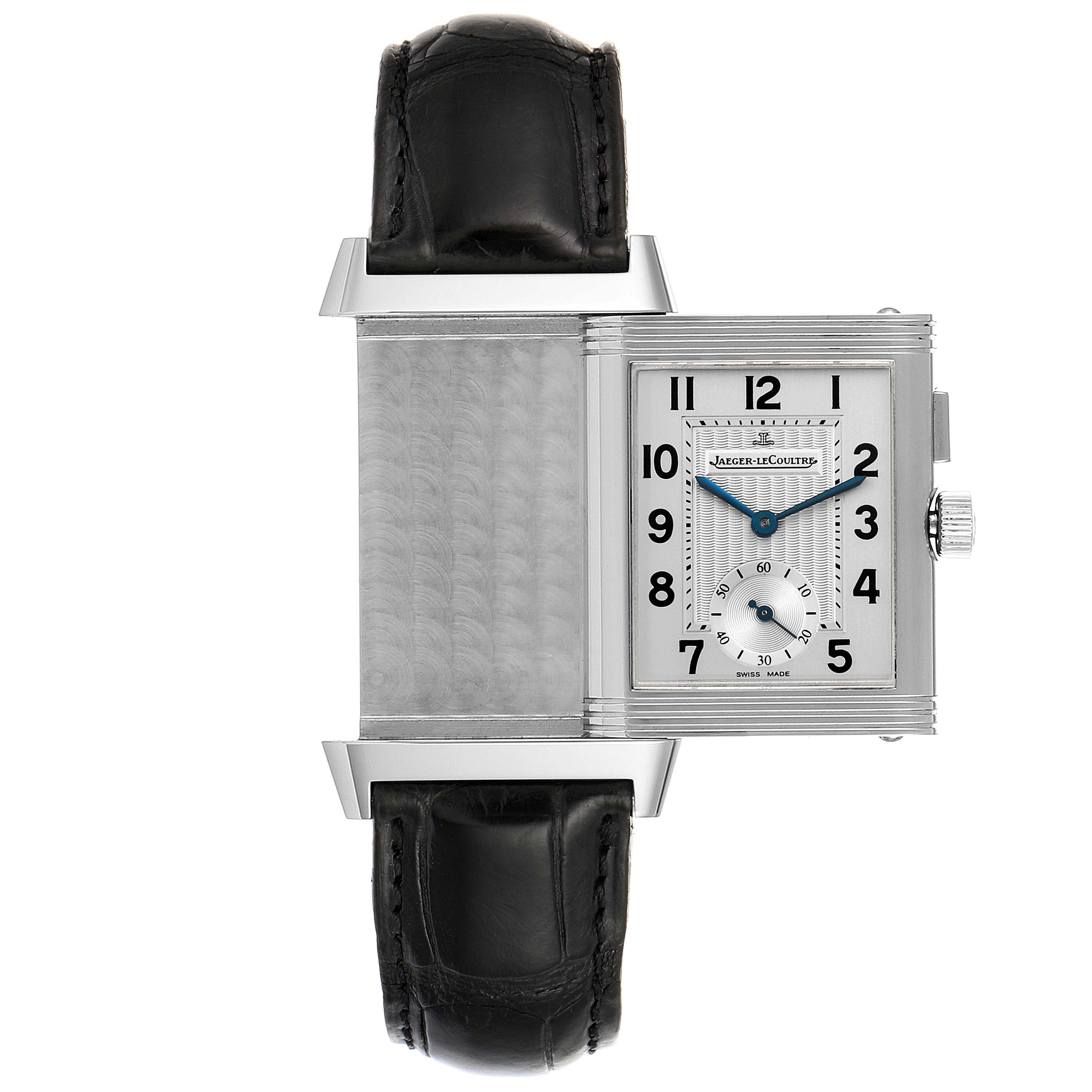 The image shows a Jaeger LeCoultre Reverso Q2458420 Men's Stainless Steel Silver Dial Q2458420 Men's Stainless Steel Silver Dial watch partially rotated to reveal its reverse side and leather strap.