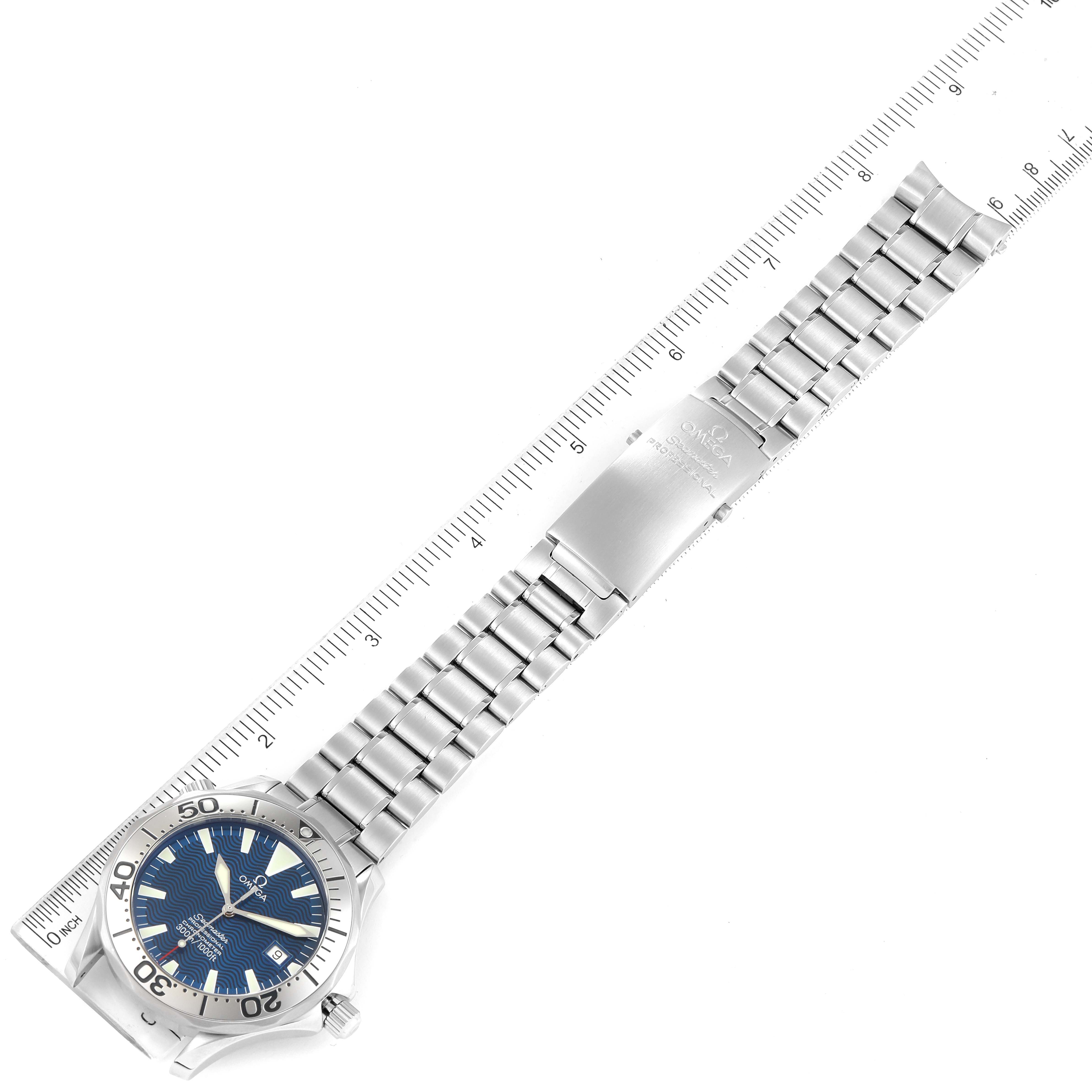 The image shows an Omega Seamaster 2255.80.00 Men's Stainless Steel Blue Dial 2255.80.00 Men's Stainless Steel Blue Dial watch laid flat with a metal bracelet and bezel, next to a ruler for scale.