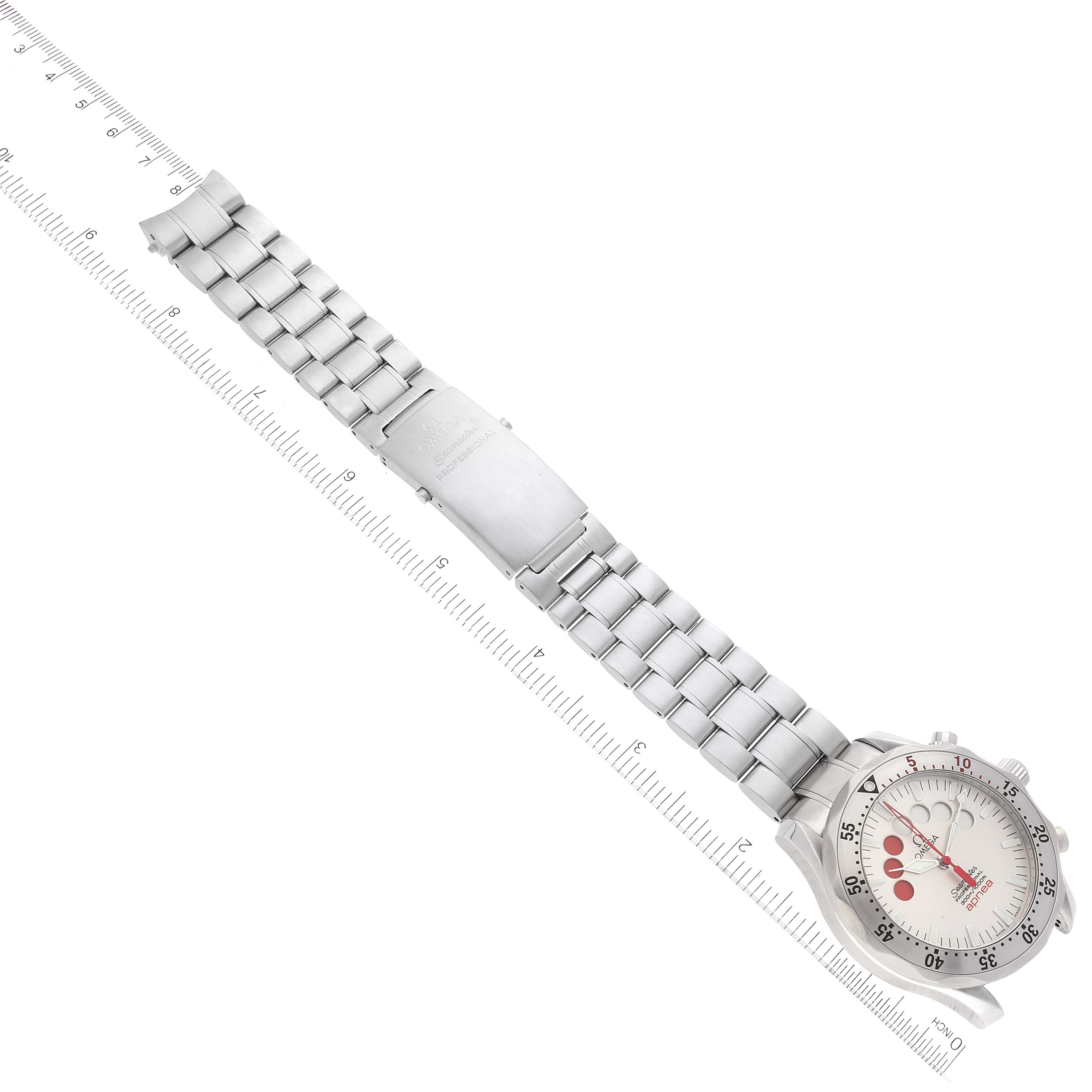 The image shows the full length of an Omega Seamaster 2595.30.00 Men's Stainless Steel Silver Dial 2595.30.00 Men's Stainless Steel Silver Dial watch, displaying its face, bezel, bracelet, and clasp alongside a ruler for scale.