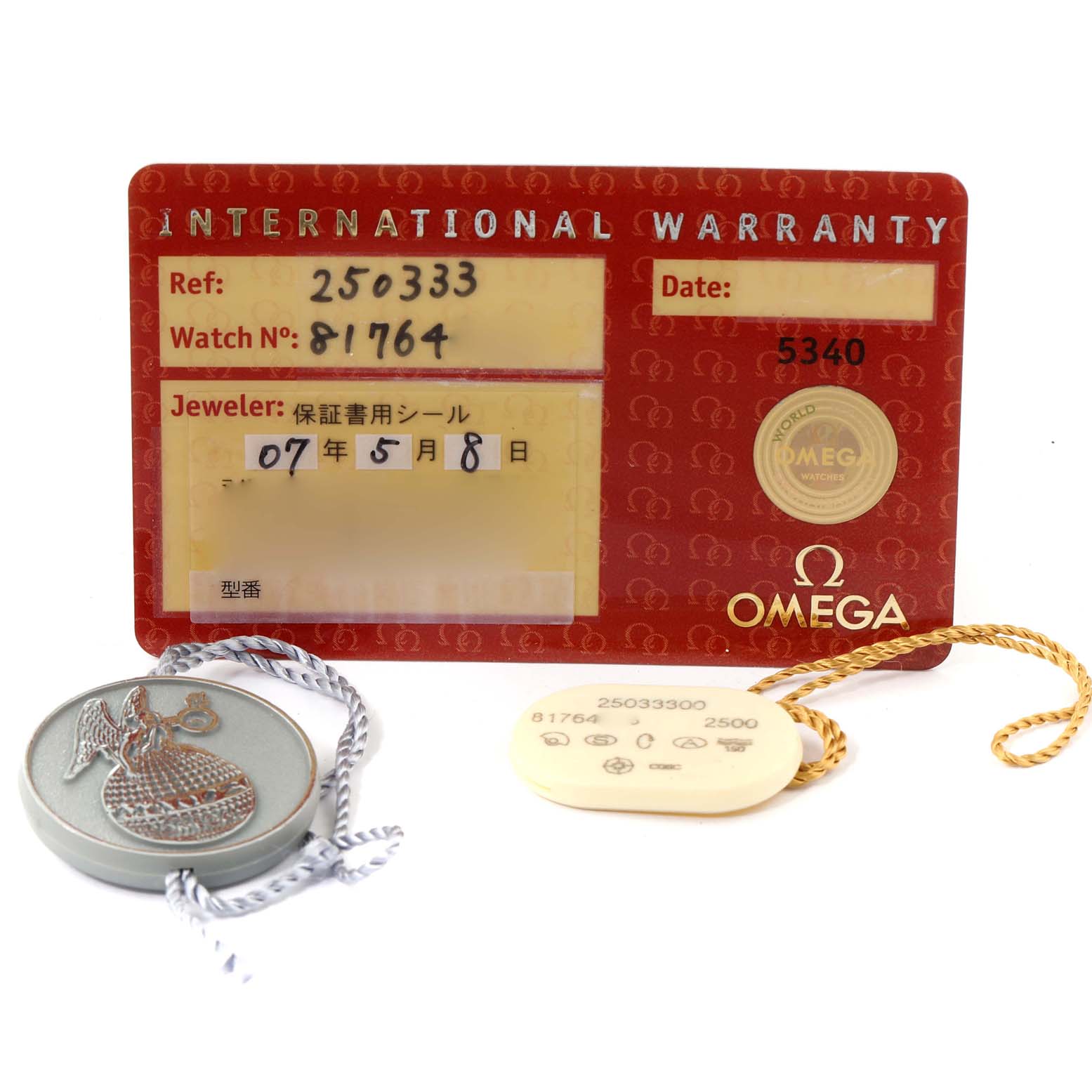 This image shows the international warranty card and various tags that belong to an Omega Aqua Terra 2503.33.00 Men
s Stainless Steel Silver Dial 2503.33.00 Men
s Stainless Steel Silver Dial watch.