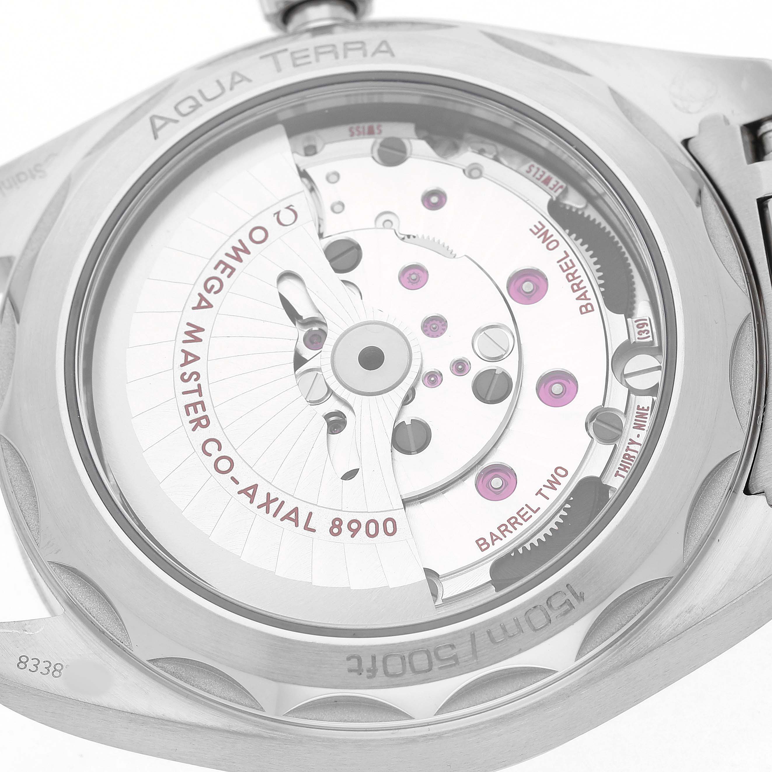 The image shows the back of the Omega Aqua Terra 220.10.41.21.10.001 Men's Stainless Steel Green Dial watch, highlighting its movement and internal components.