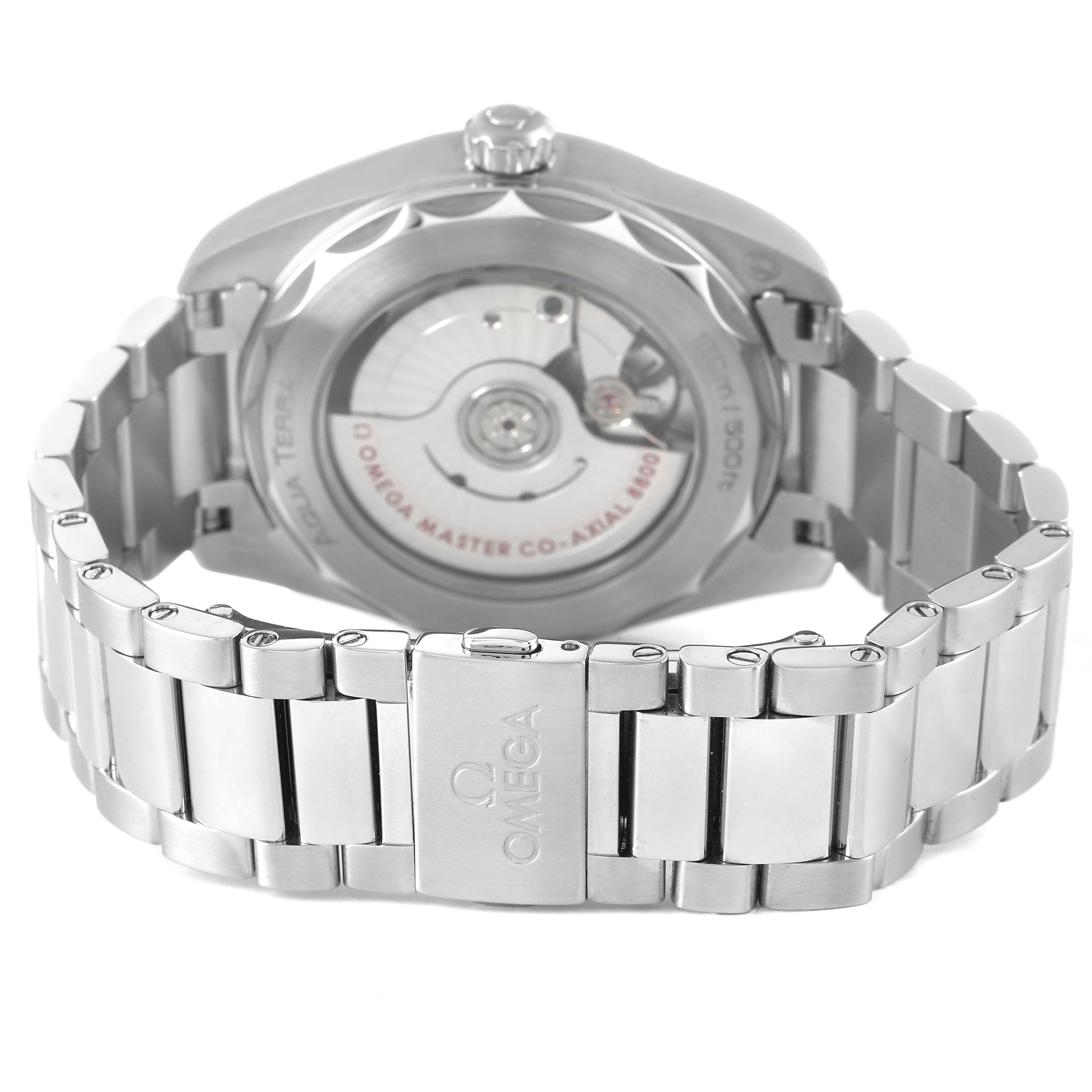 The image shows the back view of an Omega Aqua Terra 220.10.38.20.03.002 Men's Stainless Steel Blue Dial watch, highlighting the visible movement and metal bracelet.