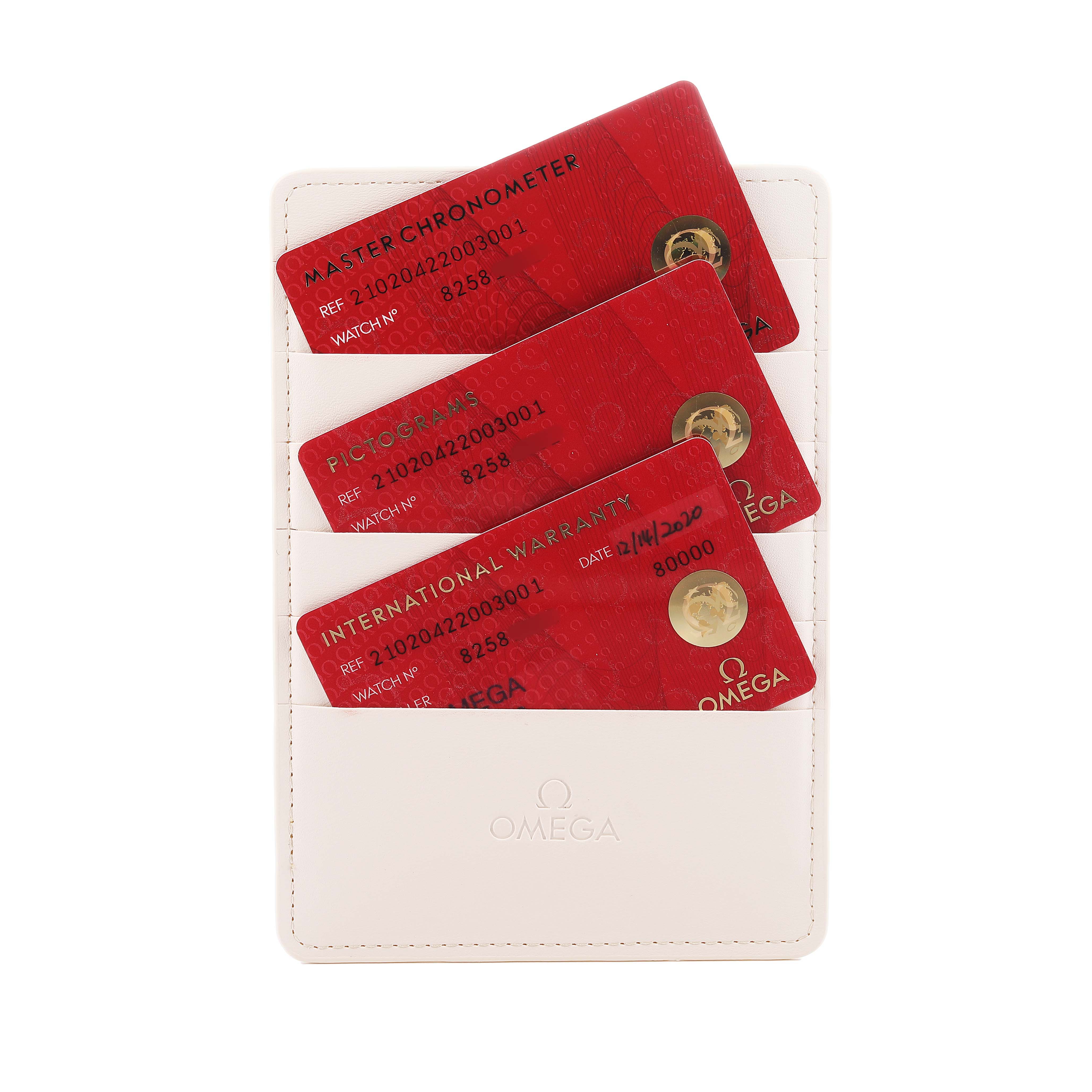 The image shows Omega Seamaster 210.20.42.20.03.001 Men's Steel and Gold (two tone) Blue Dial model accessories, including warranty and certification cards in a white cardholder.