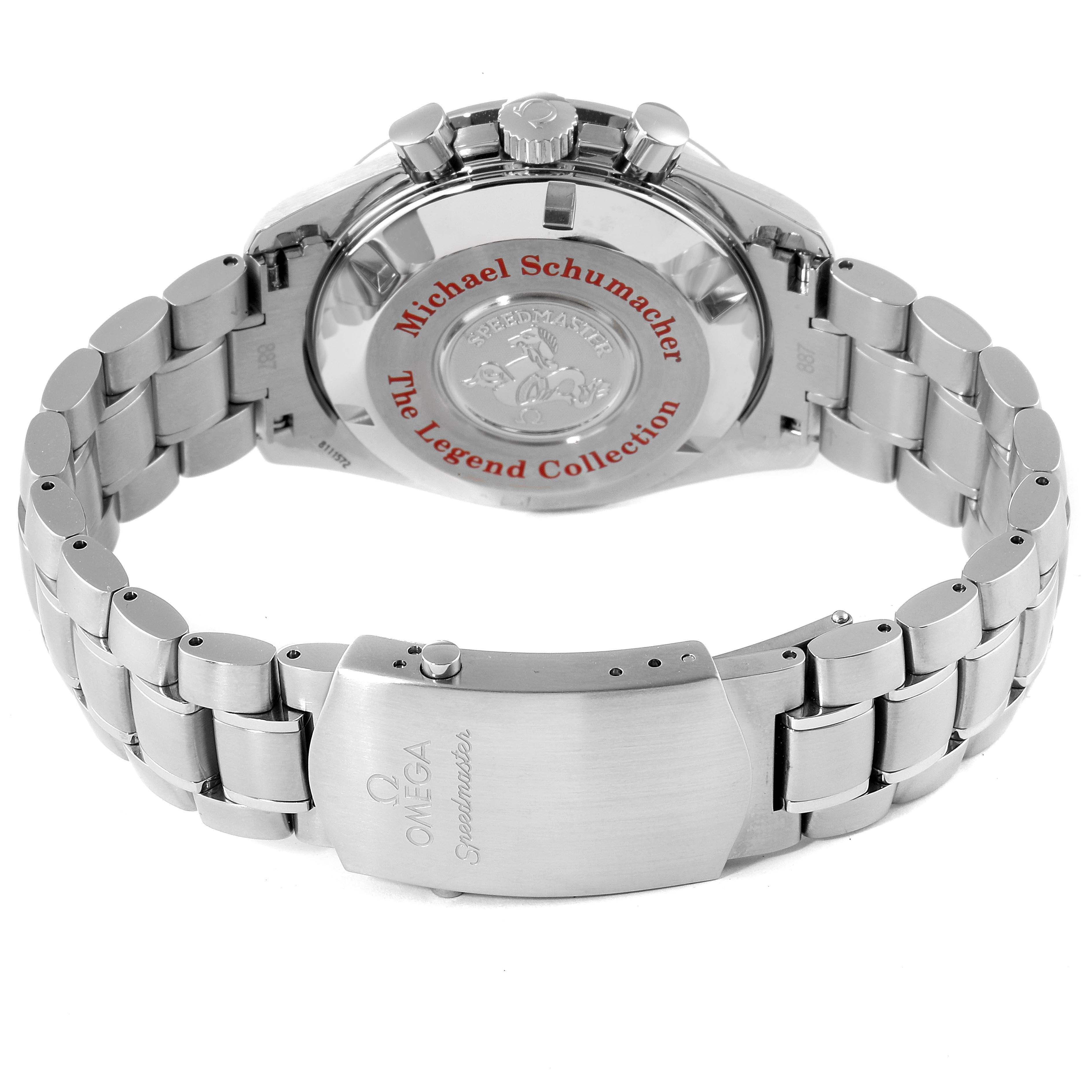 The image shows the back and bracelet of the Omega Speedmaster 3506.61.00 Men
s Stainless Steel Red Dial 3506.61.00 Men
s Stainless Steel Red Dial with "Michael Schumacher The Legend Collection" engraved on the case back.