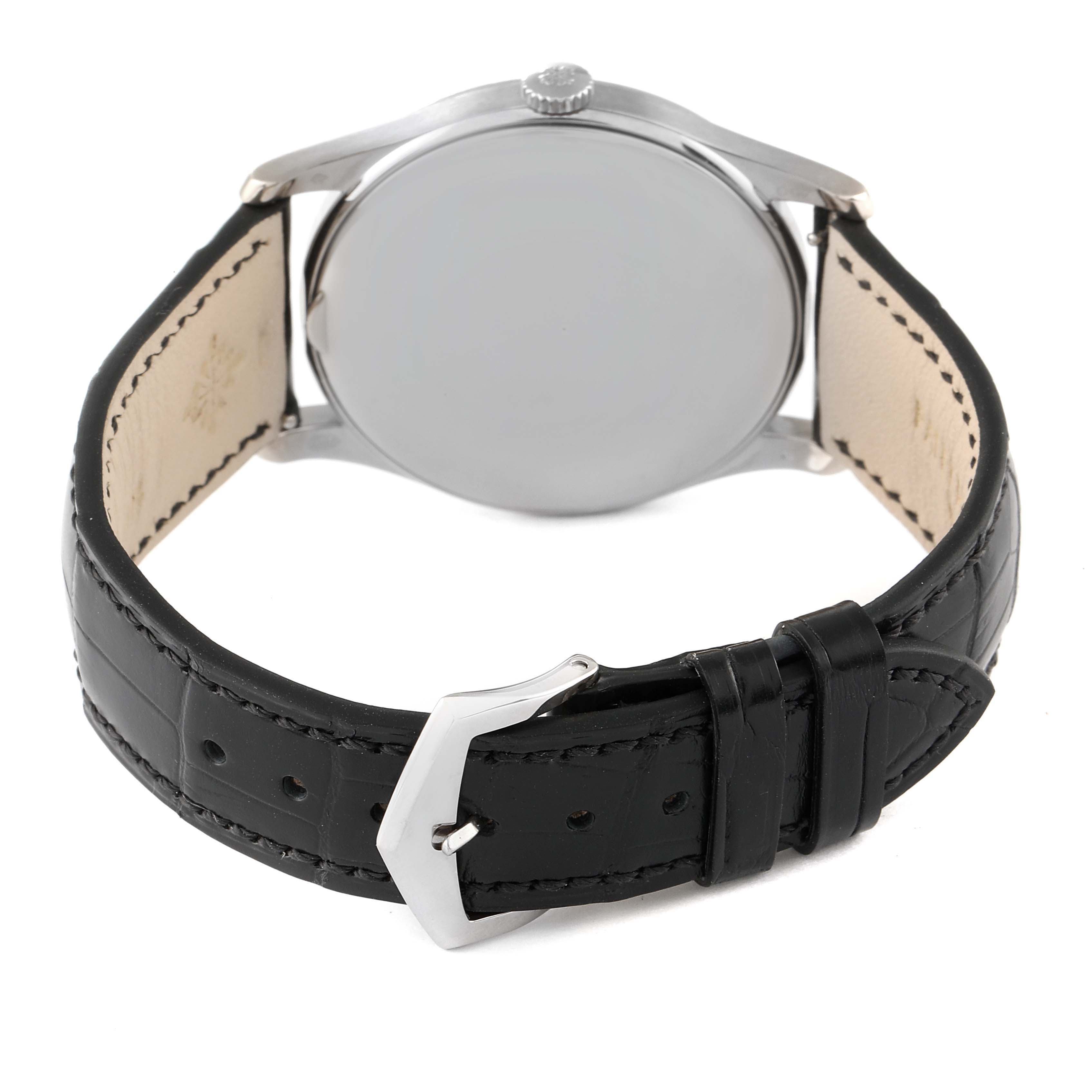 The image shows the back view of a Patek Philippe Calatrava 5196G Men's White Gold Silver Dial 5196G Men's White Gold Silver Dial watch, highlighting its black leather strap and buckle.