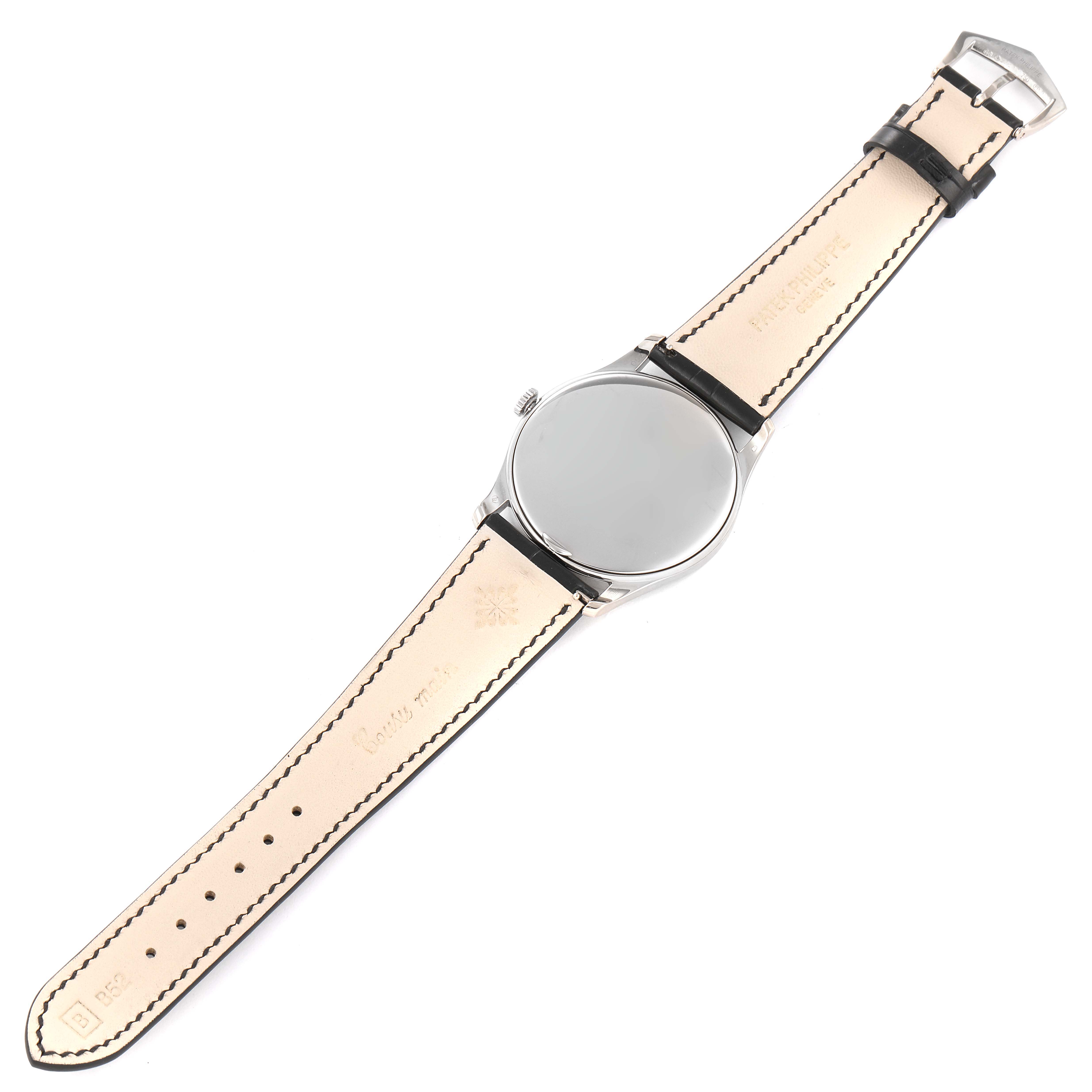 The image shows the back view of a Patek Philippe Calatrava 5196G Men's White Gold Silver Dial 5196G Men's White Gold Silver Dial watch, highlighting the leather strap and metal case back.