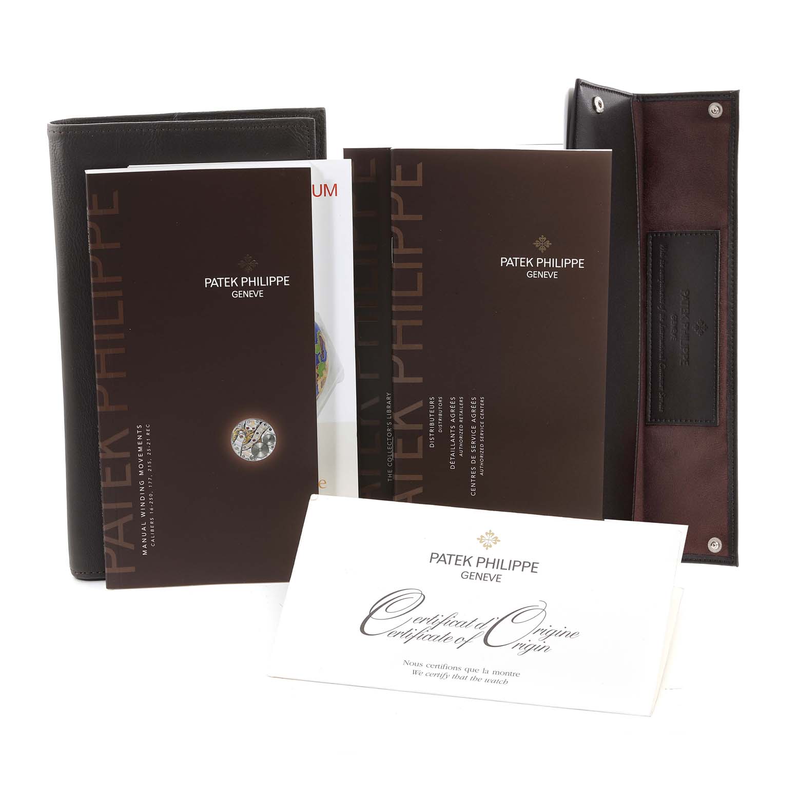 The image shows accessories for a Patek Philippe Calatrava 5196G Men's White Gold Silver Dial 5196G Men's White Gold Silver Dial watch, including booklets, a certificate of origin, and a leather pouch.
