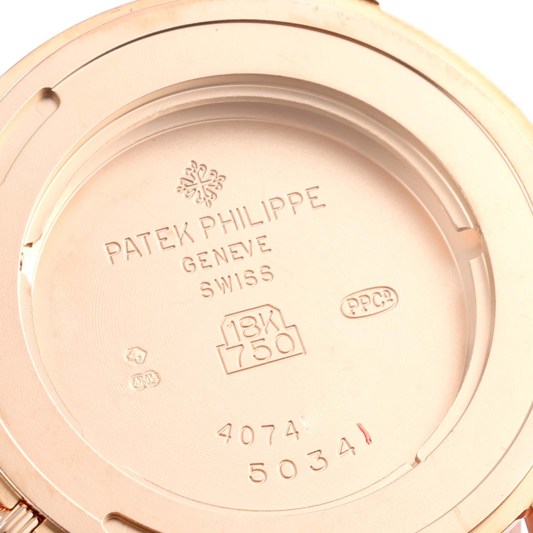 This is the case back of a Patek Philippe Calatrava 5034R Men
s Rose Gold White Dial 5034R Men
s Rose Gold White Dial watch with engravings and hallmark stamps visible.