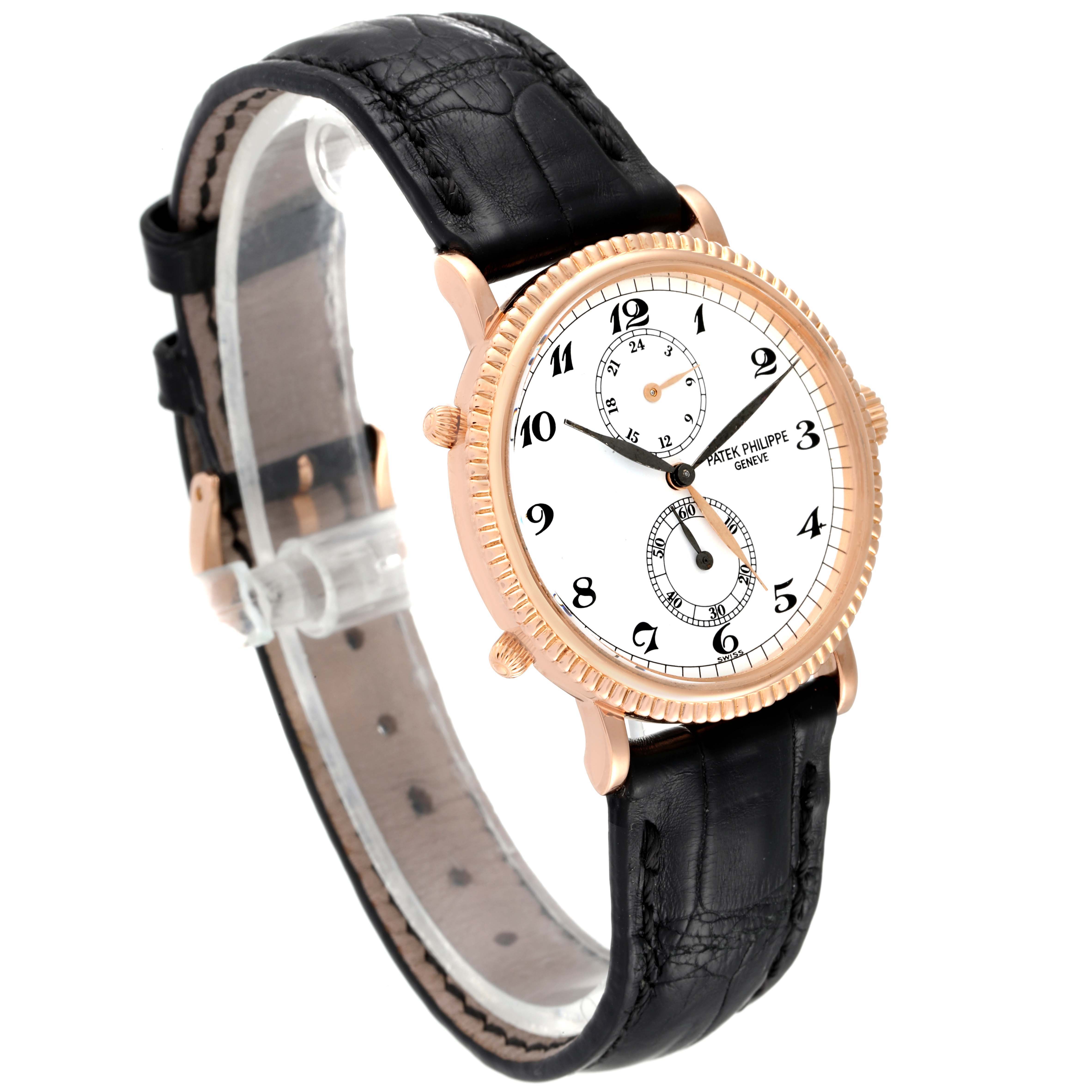 The image shows the Patek Philippe Calatrava 5034R Men
s Rose Gold White Dial 5034R Men
s Rose Gold White Dial watch at a three-quarter angle, highlighting its dial, case, and leather strap.