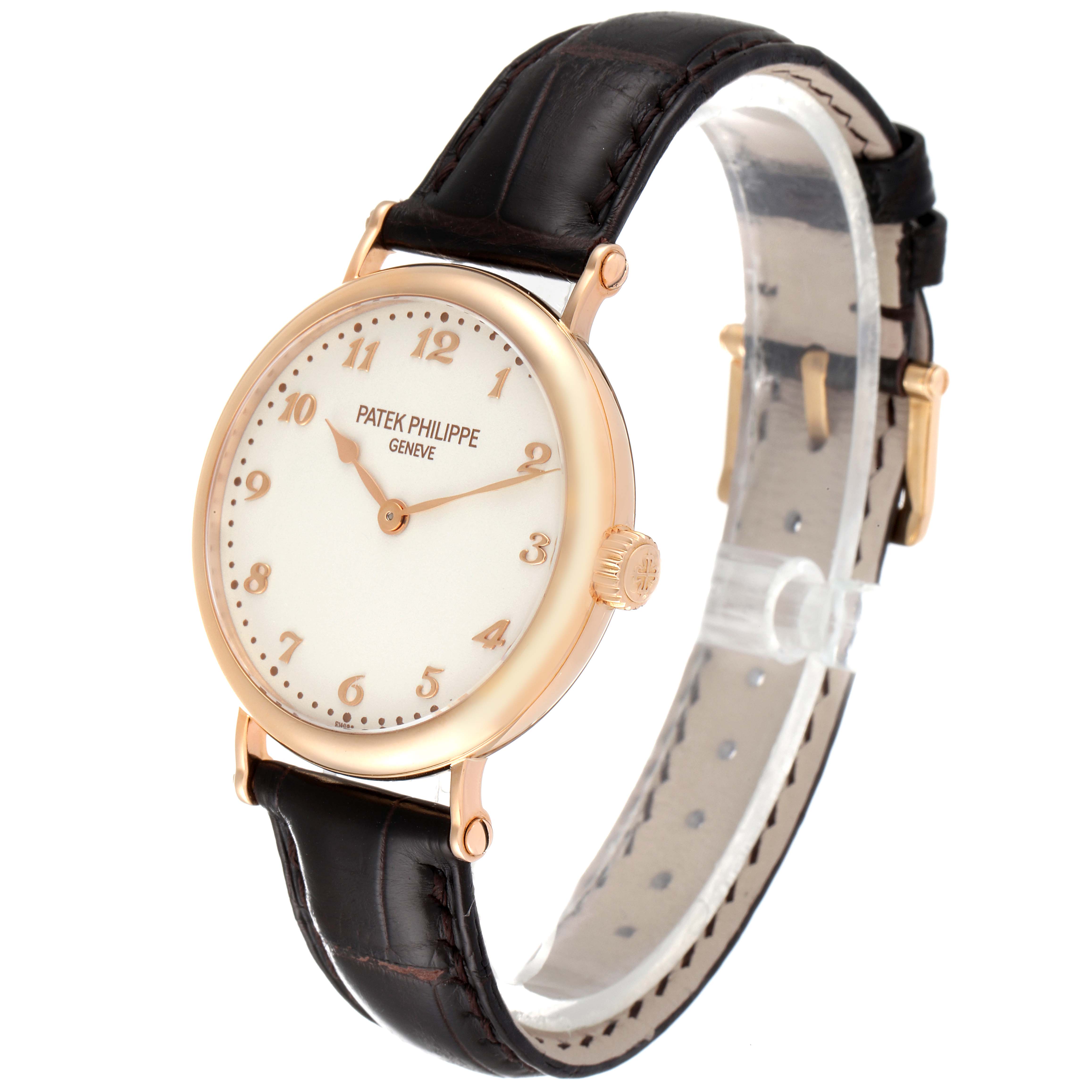 The image shows a Patek Philippe Calatrava 7200R Men
s Rose Gold Silver Dial 7200R Men
s Rose Gold Silver Dial watch from a front angle, highlighting its dial, case, and leather strap.