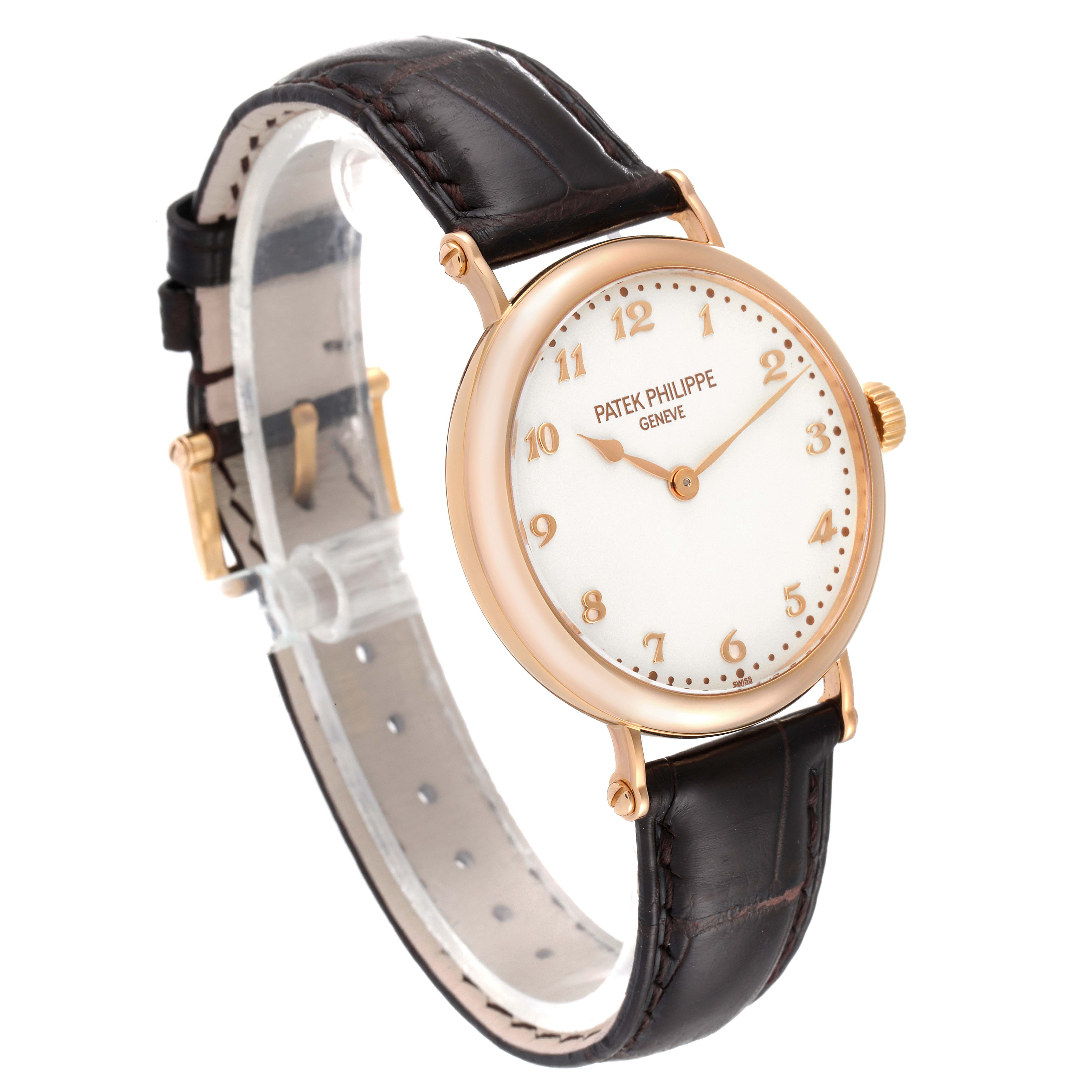 The image shows a side-angle view of the Patek Philippe Calatrava 7200R Men
s Rose Gold Silver Dial 7200R Men
s Rose Gold Silver Dial watch, highlighting its round face, gold numerals, and black leather strap.