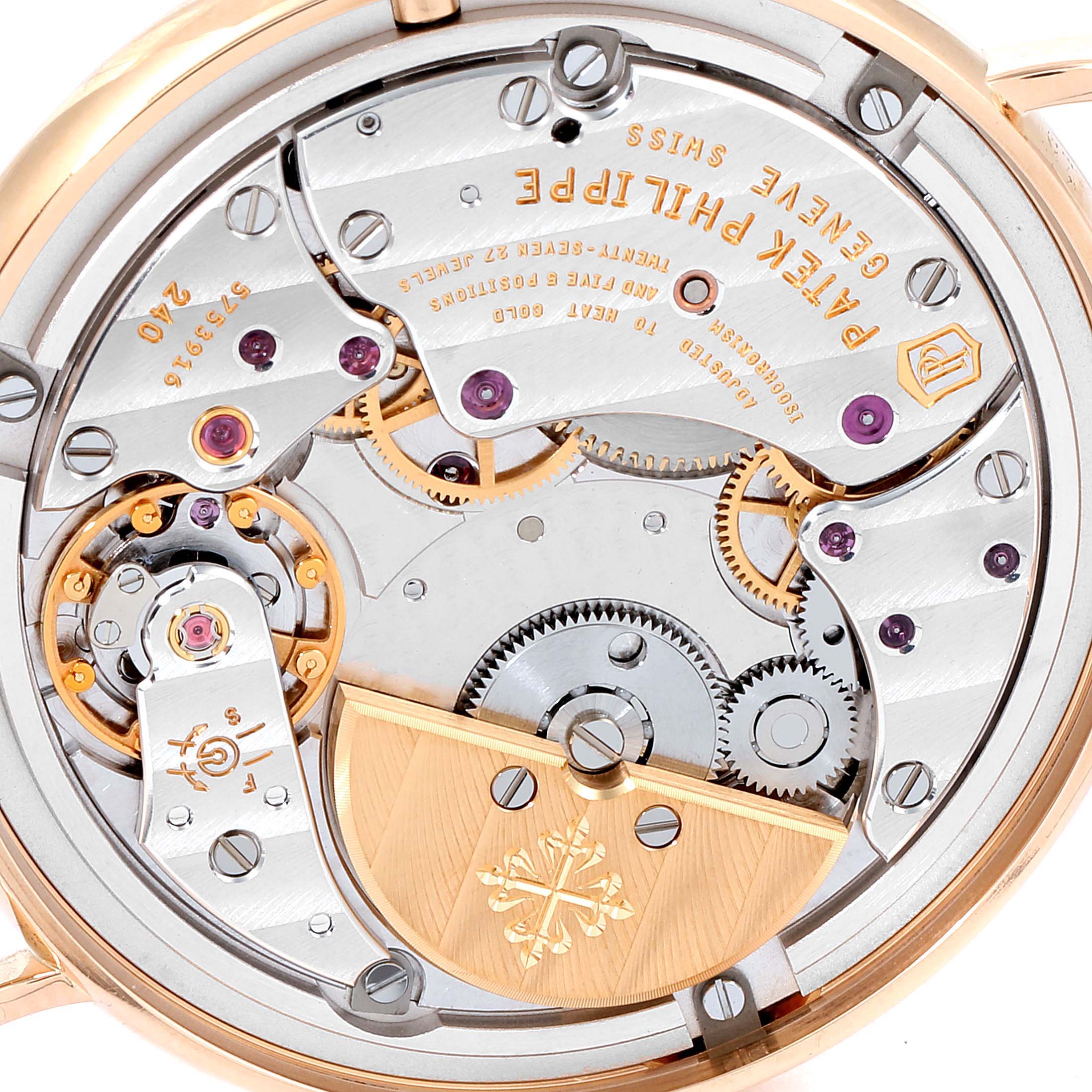 This close-up image shows the intricate inner movement and mechanics of a Patek Philippe Calatrava 7200R Men
s Rose Gold Silver Dial 7200R Men
s Rose Gold Silver Dial watch.