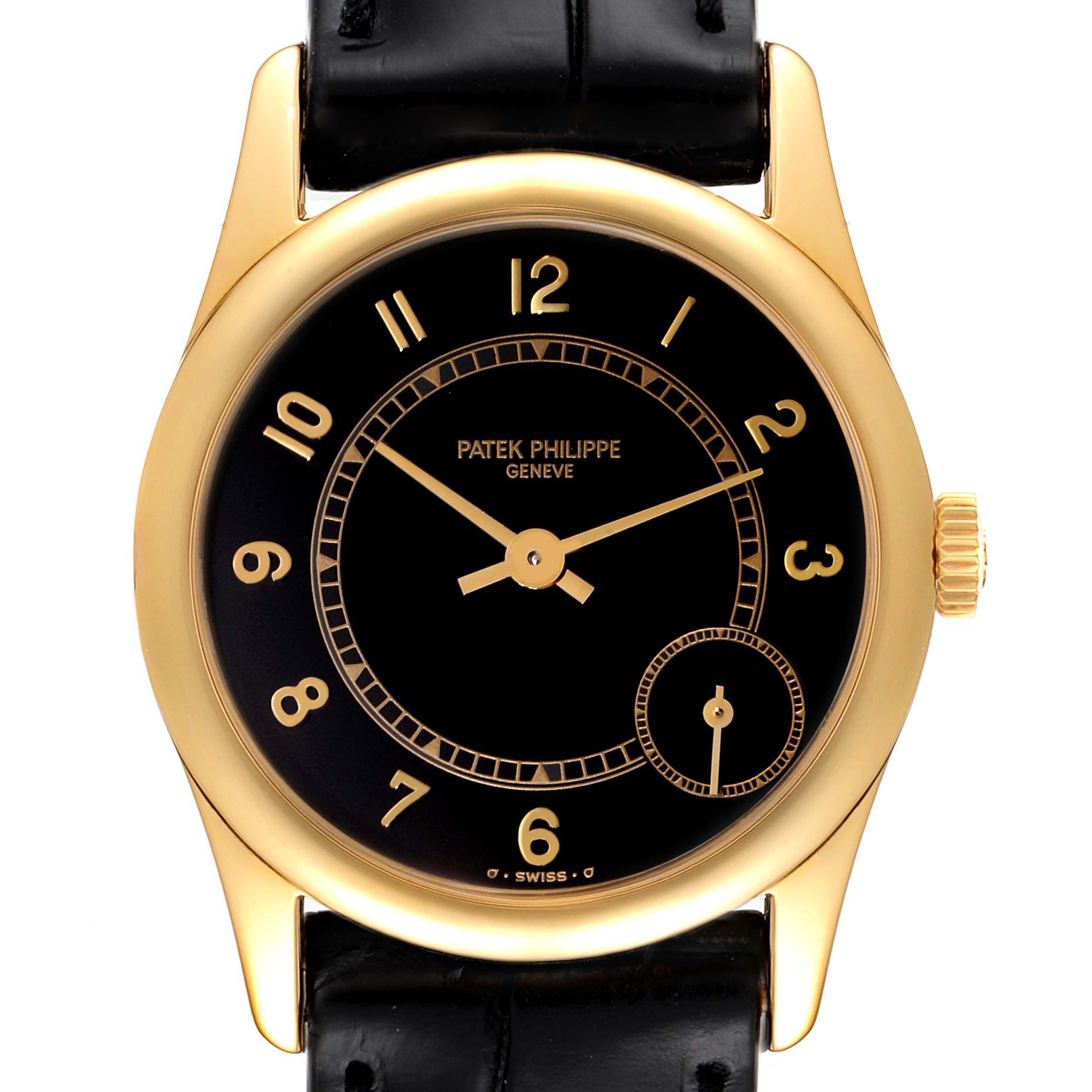 The image shows a frontal view of a Patek Philippe Calatrava 5000J Women's Yellow Gold Black Dial 5000J Women's Yellow Gold Black Dial watch, highlighting its gold-tone case, black dial, and gold numerals.