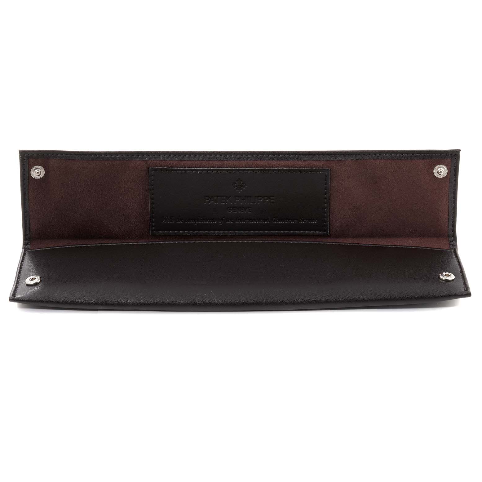 This image shows an open leather case for a Vintage model by Patek Philippe, displaying the interior with the logo embossed.