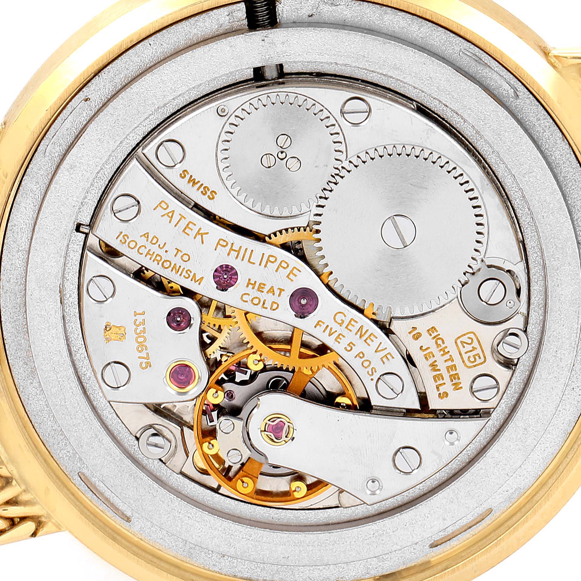 This image shows the intricate inner mechanism of a Vintage Patek Philippe watch, viewed from the back.
