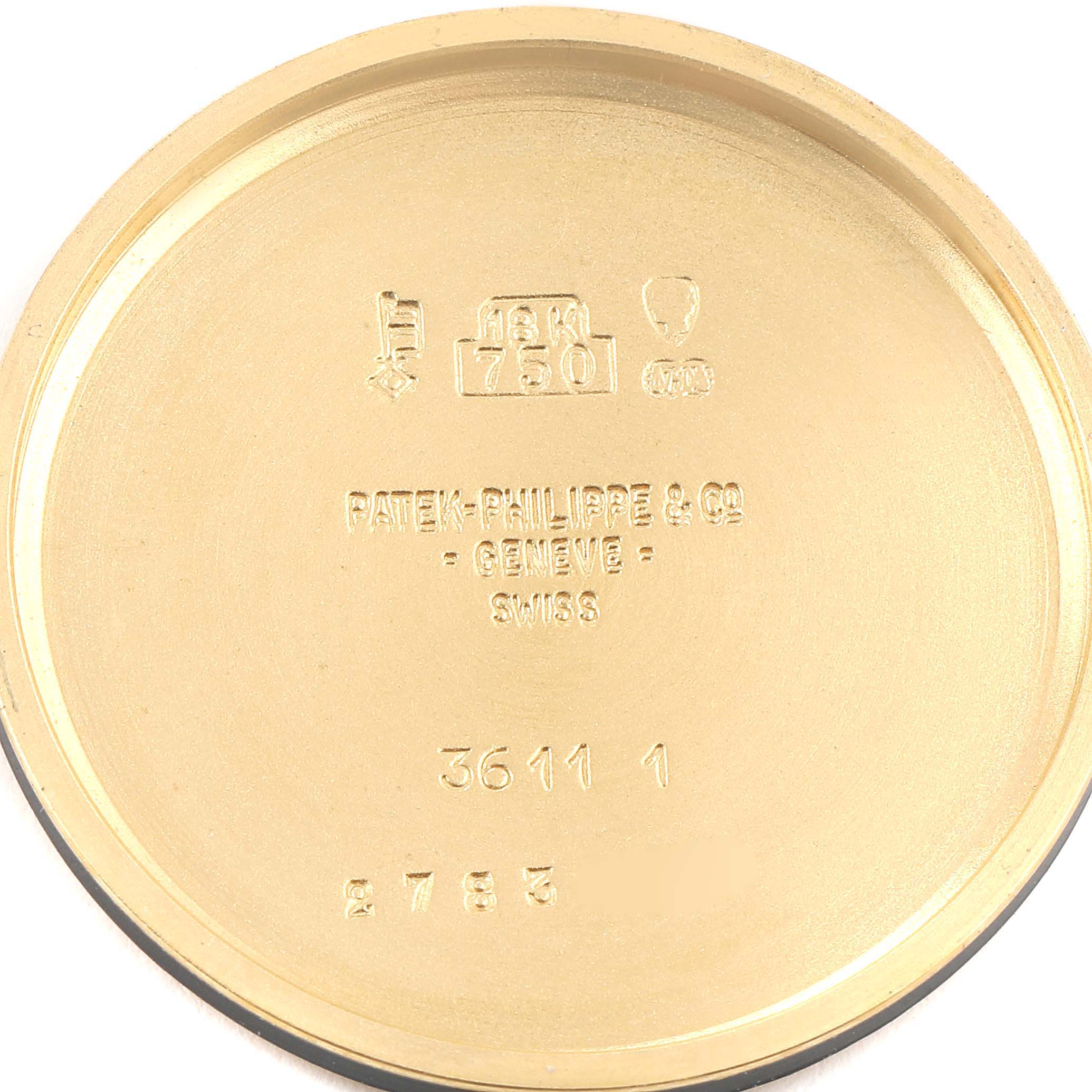 This image shows the inside case back of a Vintage Patek Philippe watch, with hallmark engravings and model numbers visible.