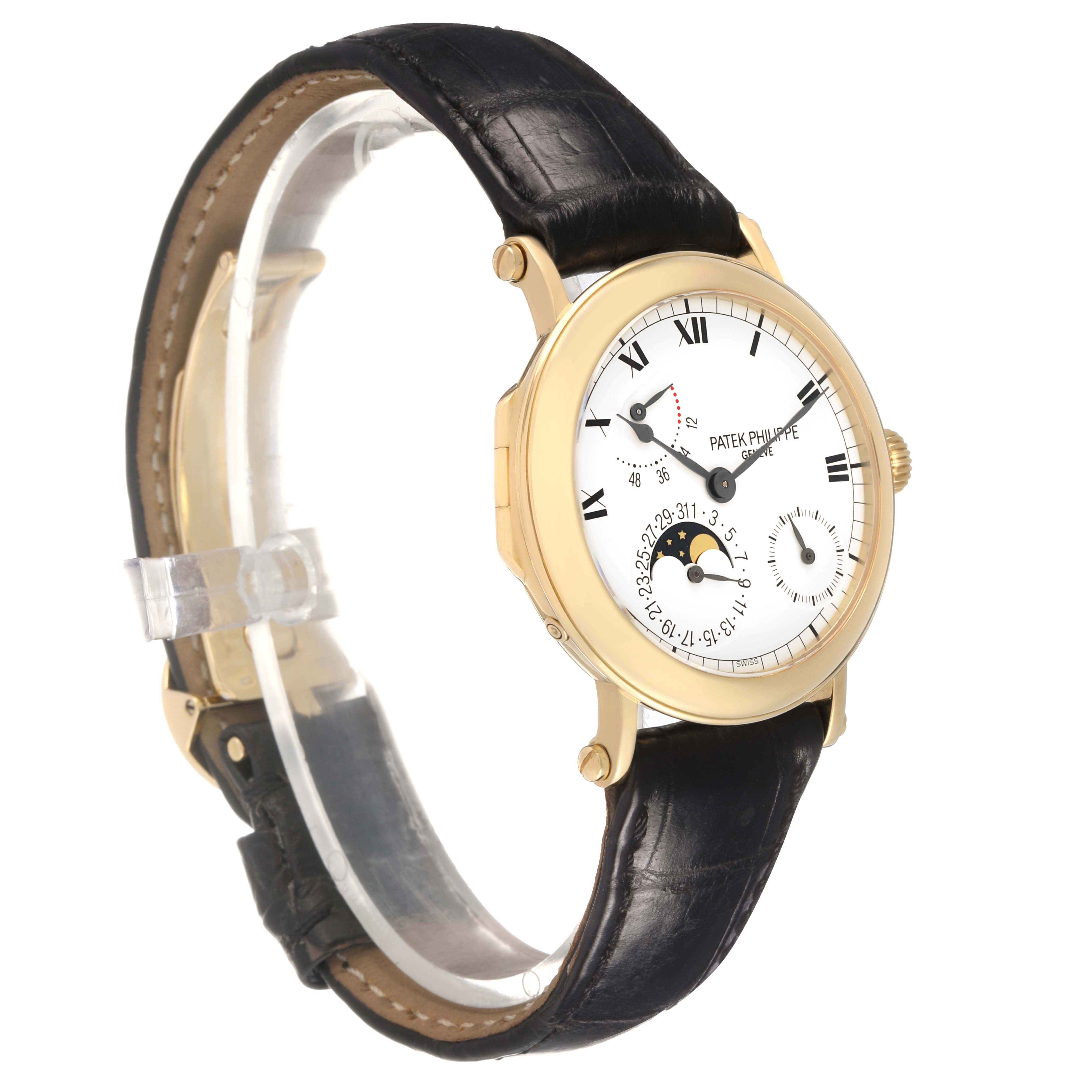 The Patek Philippe Complications 5054 Men's Yellow Gold White Dial watch is shown at a slight angle, displaying the face, bezel, and black leather strap.