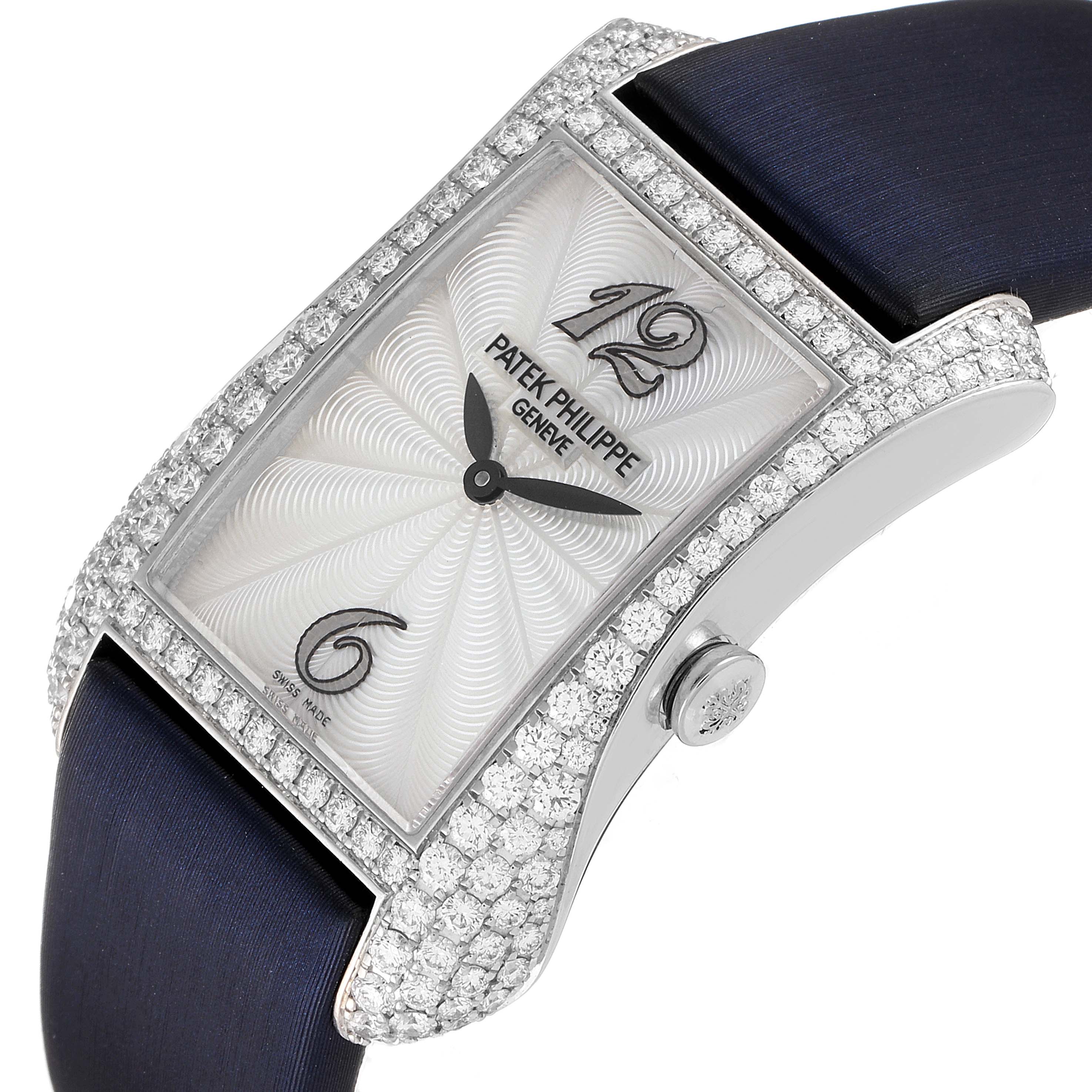 This image shows a close-up angle of the Patek Philippe Gondolo 4972G-001 Women's White Gold Mother of Pearl Dial 4972G-001 Women's White Gold Mother of Pearl Dial watch, highlighting the diamond-encrusted case and navy blue strap.