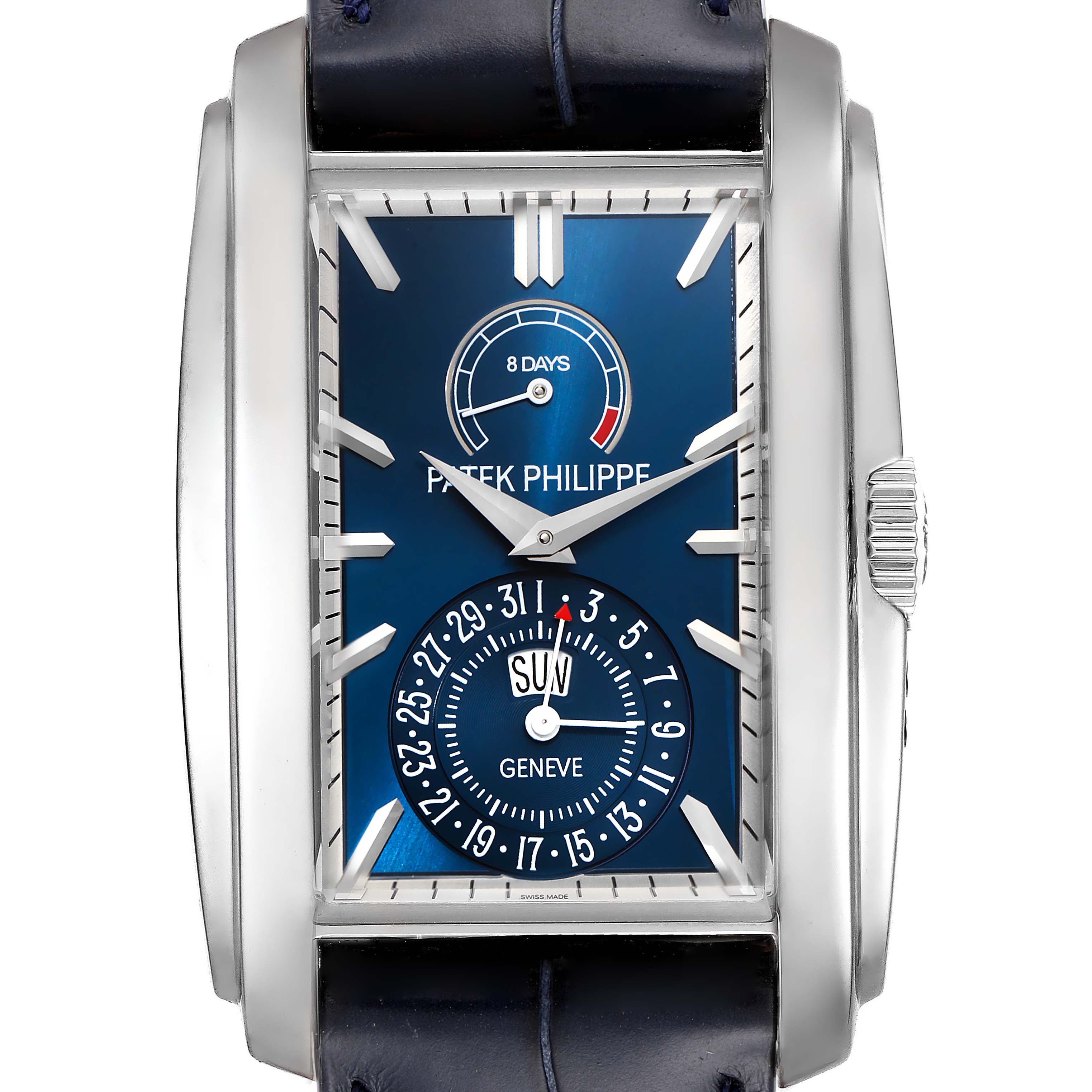 The image shows a frontal view of the Patek Philippe Gondolo 5200G-010 Men's White Gold Blue Dial 5200G-010 Men's White Gold Blue Dial watch, highlighting its blue dial, day-date subdial, and 8-day power reserve indicator.