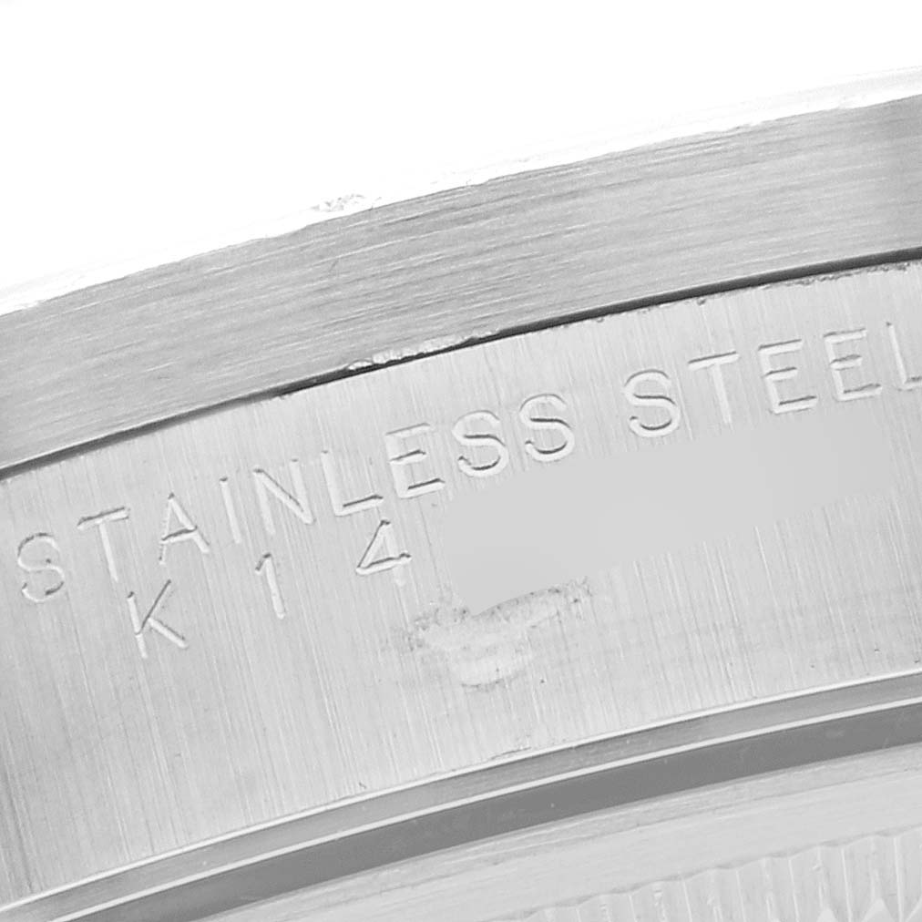 This close-up image shows the engraving on the stainless steel case back of a Rolex Air-King 14010M Men's Stainless Steel White Dial 14010M Men's Stainless Steel White Dial watch.