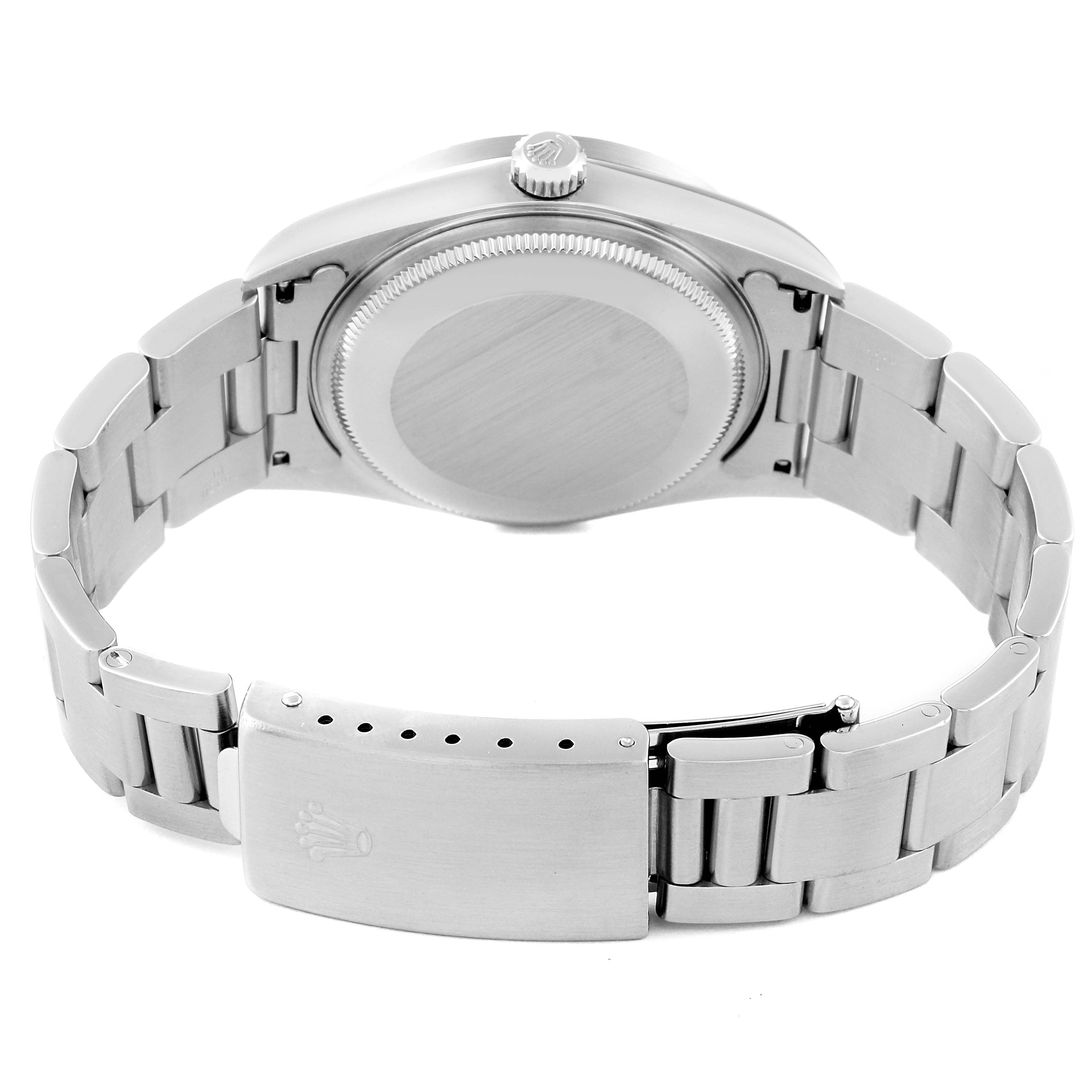 The image shows the backside of a Rolex Air-King 14010M Men's Stainless Steel White Dial 14010M Men's Stainless Steel White Dial watch, highlighting its clasp and case back.