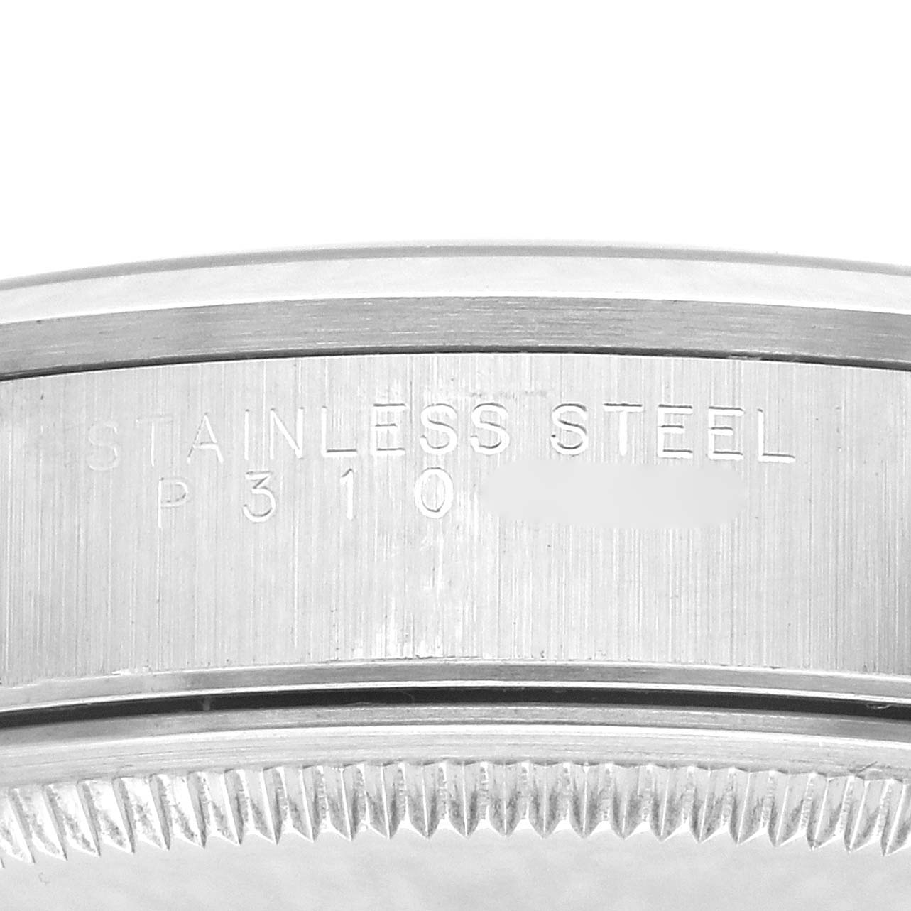 The image shows a close-up of the stainless steel case back edge of a Rolex Air-King 14000 Men's Stainless Steel Pink Dial 14000 Men's Stainless Steel Pink Dial watch, highlighting engraved details.