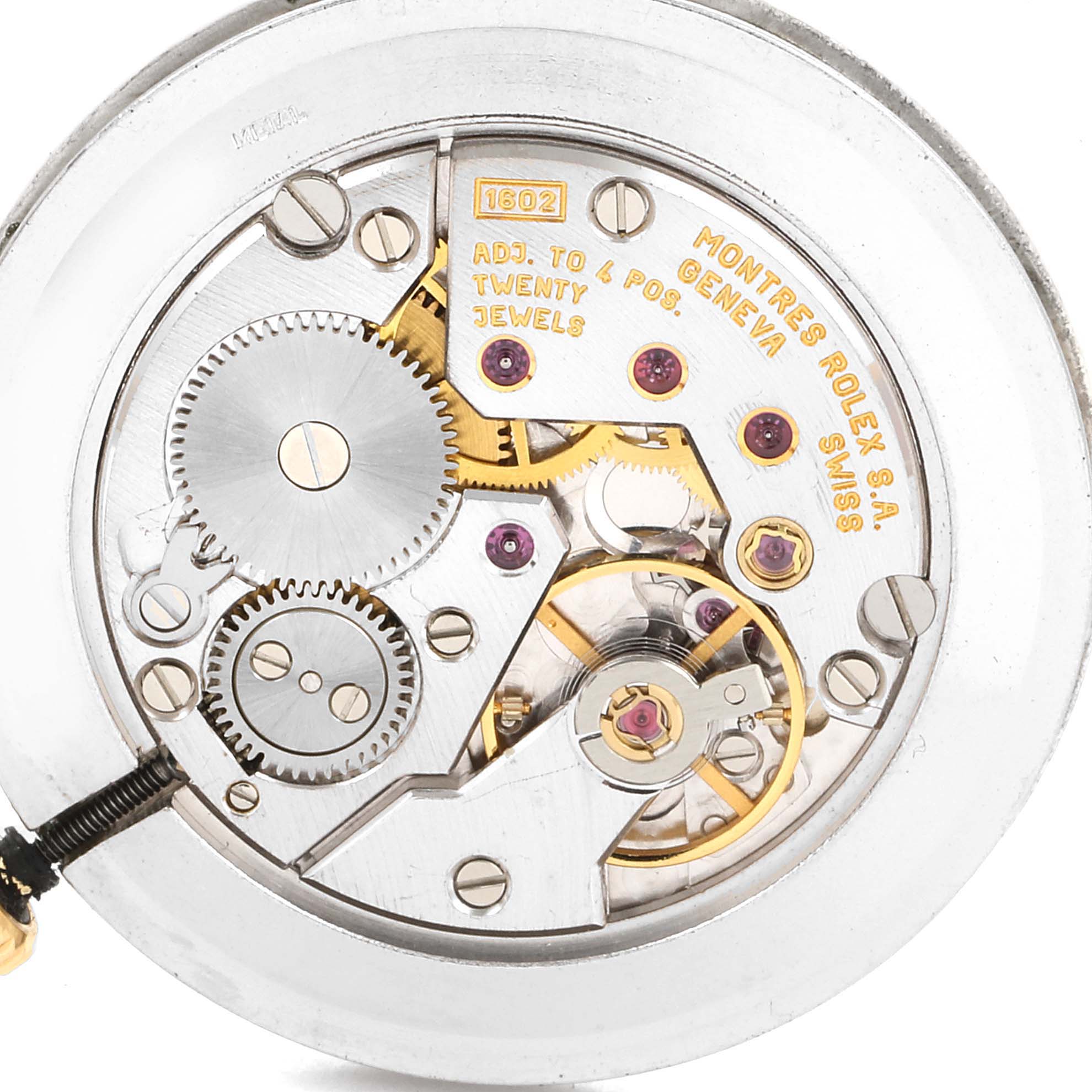This image shows the intricate internal mechanism of the Rolex Cellini 5112 Men's Yellow Gold Beige Dial 5112 Men's Yellow Gold Beige Dial watch, displaying gears and jewels at a close-up angle.