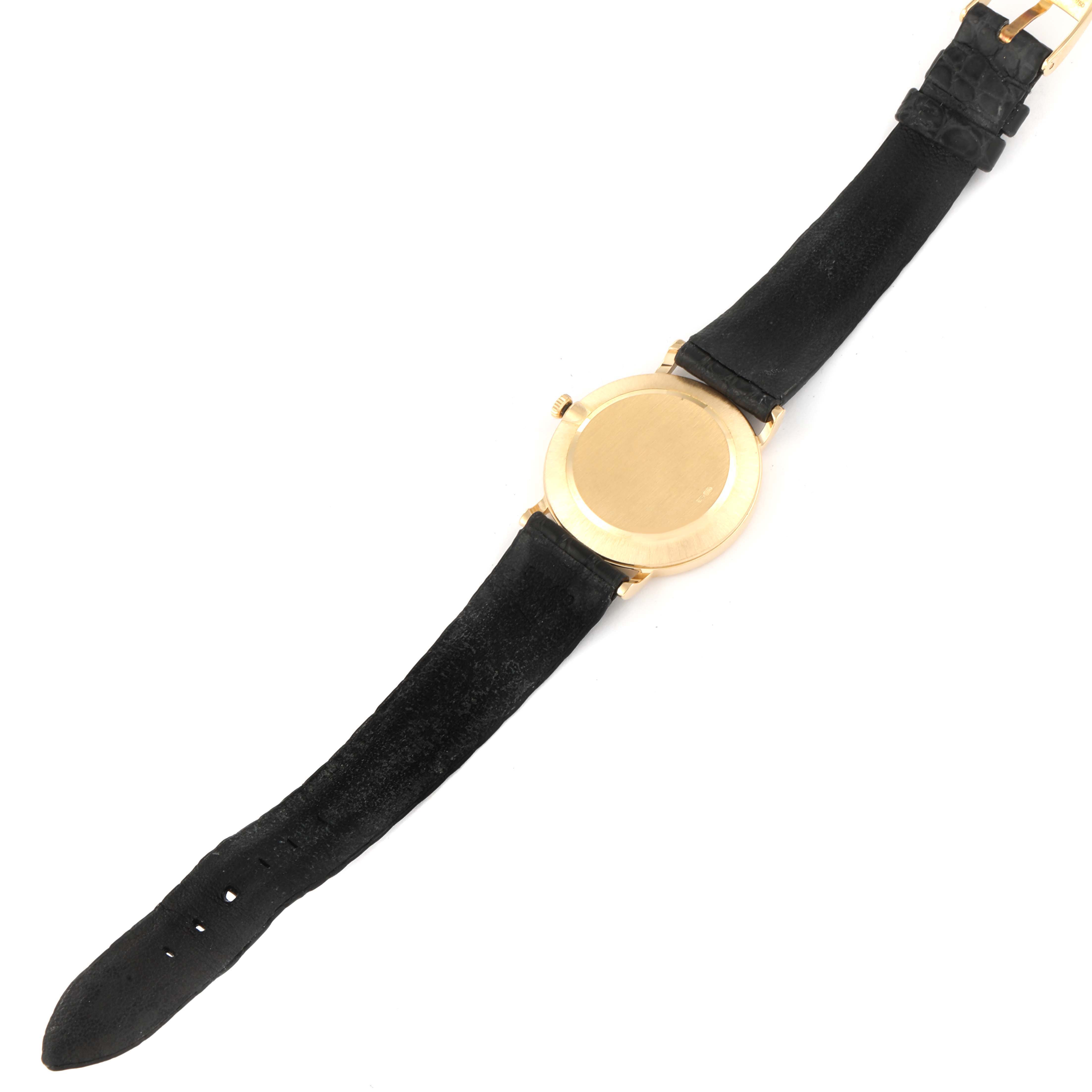 The image shows the back and strap of the Rolex Cellini 5112 Men's Yellow Gold Beige Dial 5112 Men's Yellow Gold Beige Dial model watch from a top-down angle.