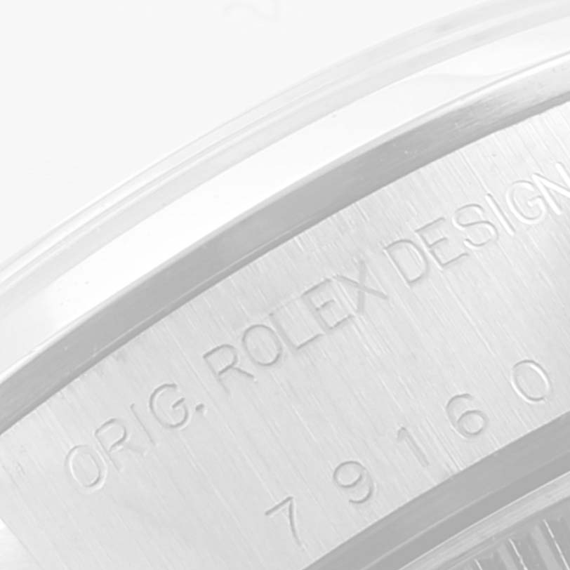 This image shows a close-up of the case side of a Rolex Date 79160 Women
s Stainless Steel Black Dial 79160 Women
s Stainless Steel Black Dial model, specifically highlighting the engraved serial and model number.