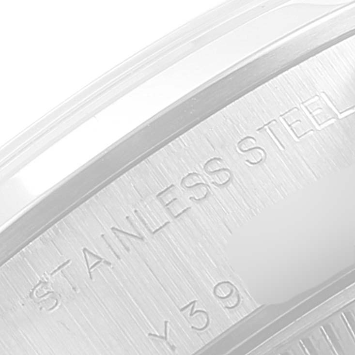 The image shows a close-up angled view of the case back of a Rolex Date 79160 Women
s Stainless Steel Black Dial 79160 Women
s Stainless Steel Black Dial model, highlighting the "Stainless Steel" inscription.