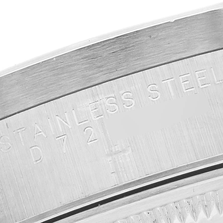 This image shows a close-up of the stainless steel case back edge of a Rolex Date 15210 Men's Stainless Steel Silver Dial 15210 Men's Stainless Steel Silver Dial model.