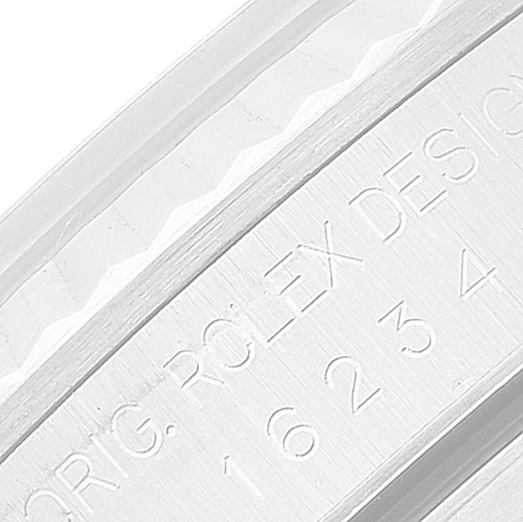 This image shows a close-up angle of the engraved bezel on a Rolex Datejust 16234 Men's Stainless Steel Black Dial 16234 Men's Stainless Steel Black Dial watch.