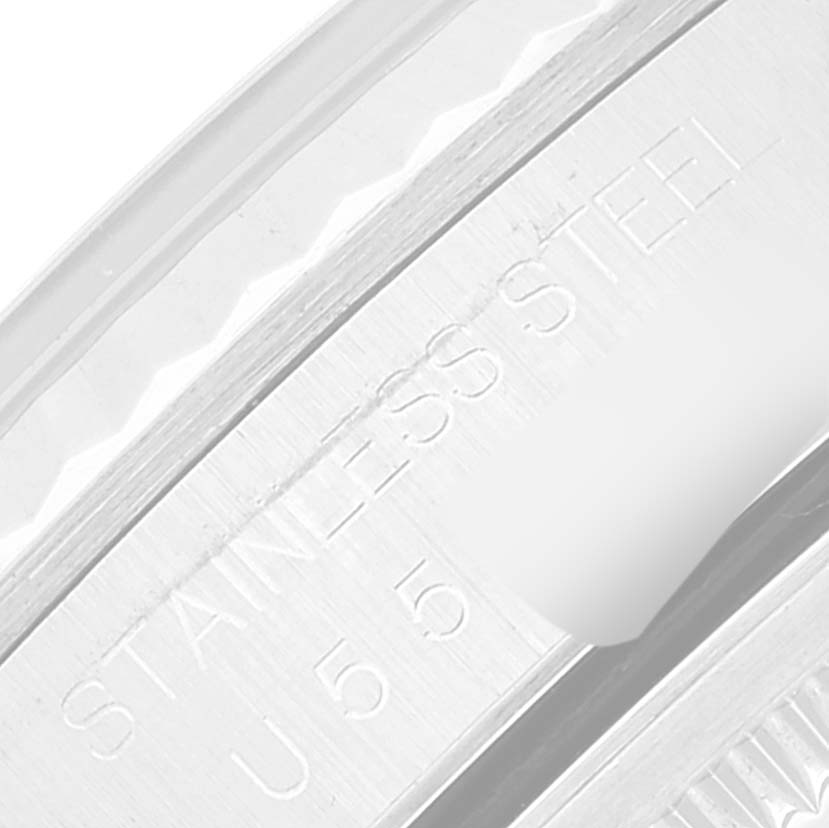 This image shows a close-up of the side engraving on the stainless steel case of a Rolex Datejust 16234 Men's Stainless Steel Black Dial 16234 Men's Stainless Steel Black Dial watch.