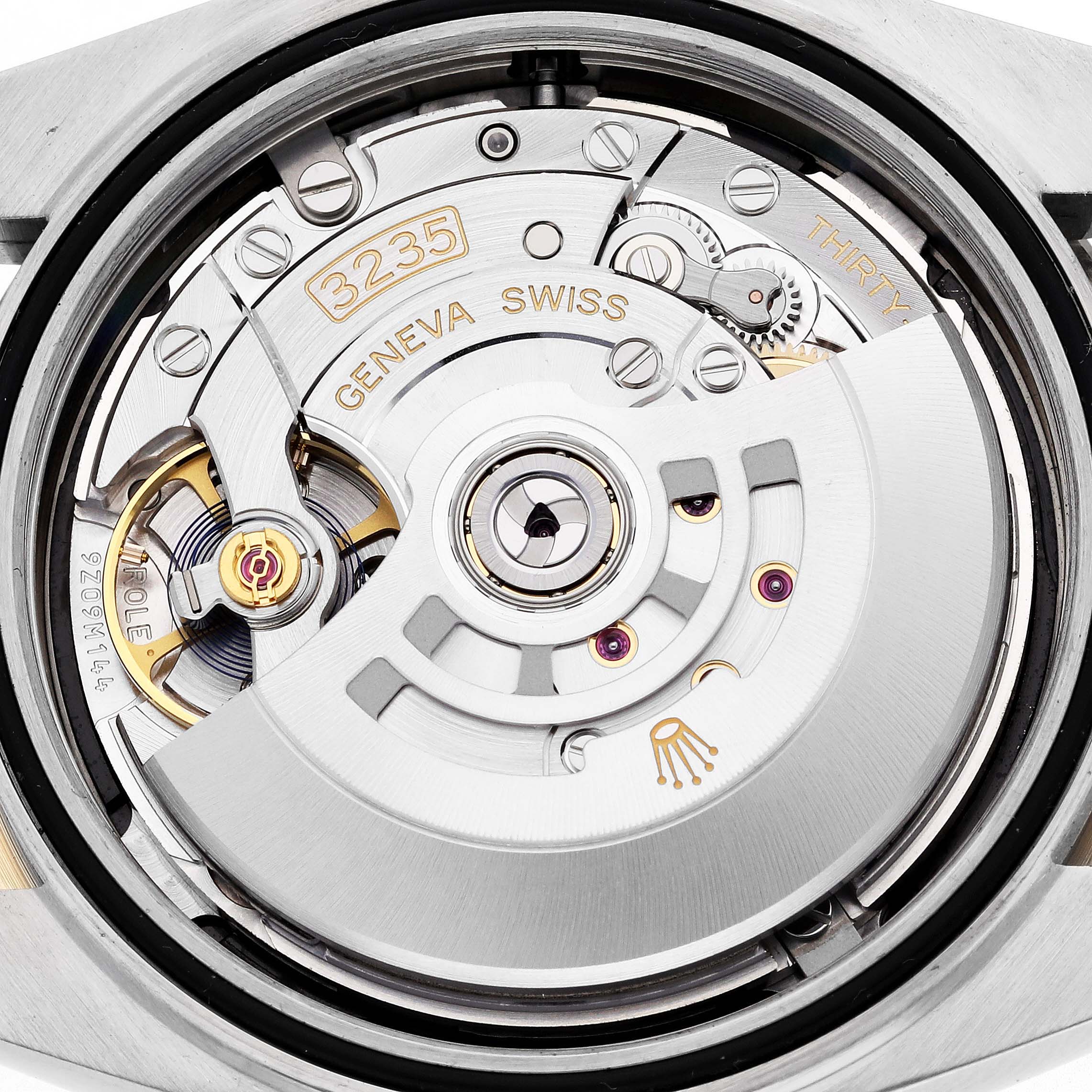 The image shows the movement of a Rolex Datejust 41 126333 Men's Steel and Gold (two tone) Black Dial 126333 Men's Steel and Gold (two tone) Black Dial, highlighting the rotor and balance wheel.