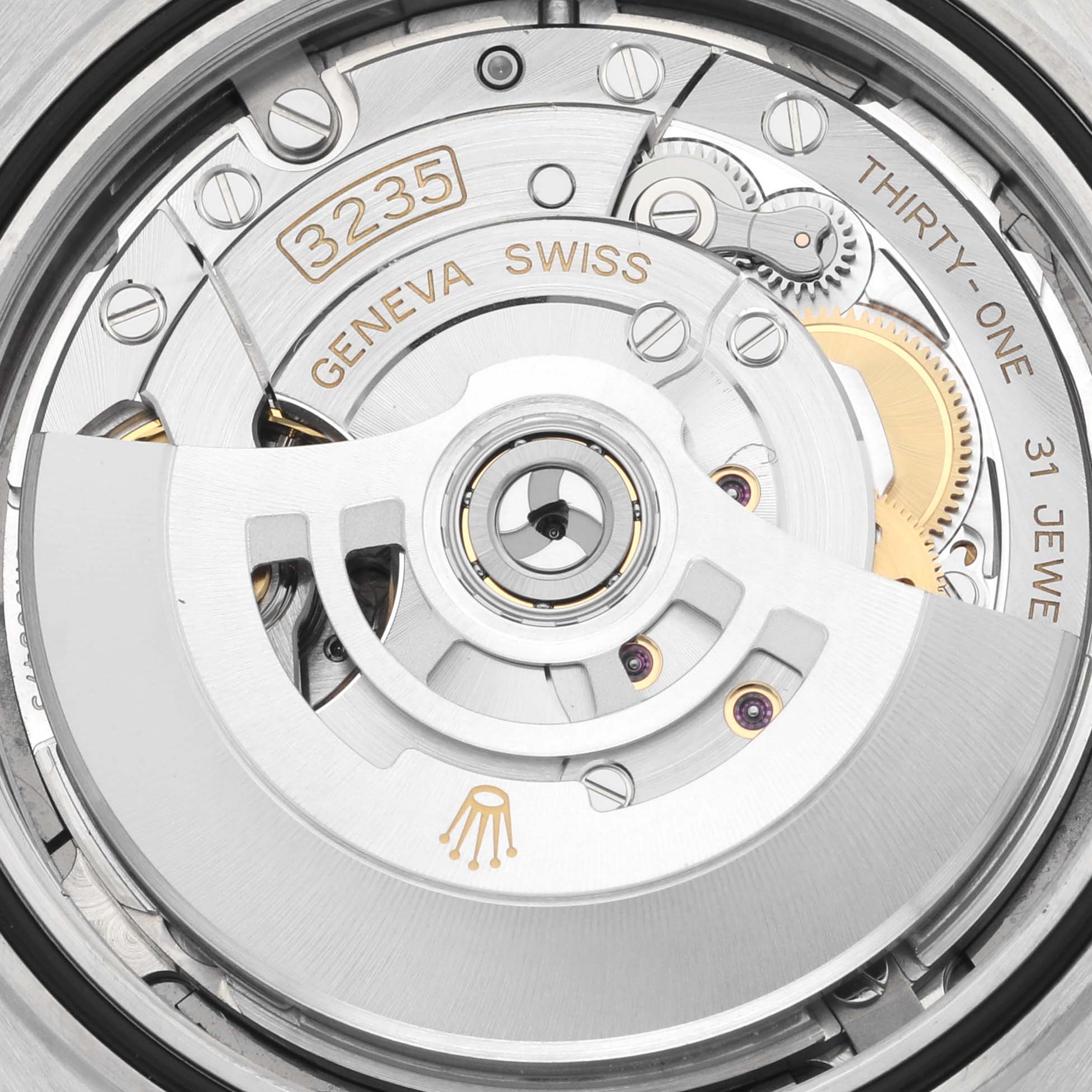 The image shows the movement of a Rolex Datejust 41 126333 Men's Steel and Gold (two tone) Grey Dial 126333 Men's Steel and Gold (two tone) Grey Dial, featuring its rotor and intricate mechanics.