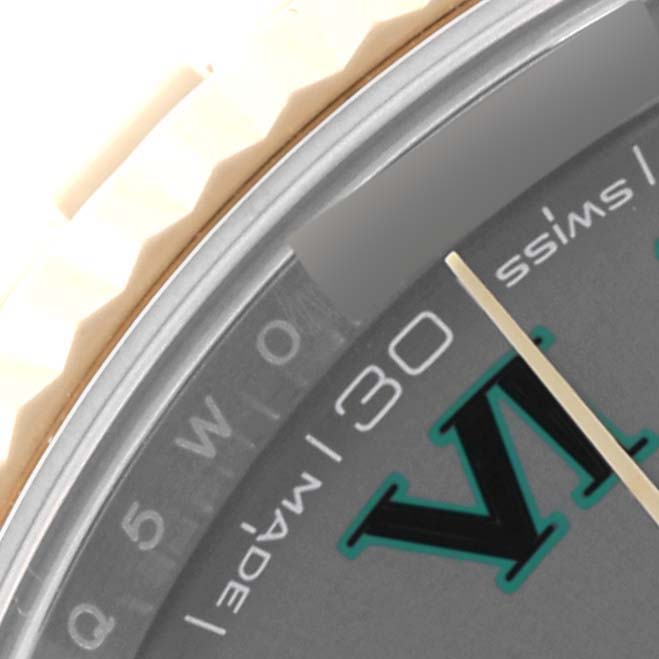This close-up of the Rolex Datejust 41 126333 Men's Steel and Gold (two tone) Grey Dial 126333 Men's Steel and Gold (two tone) Grey Dial shows the fluted bezel, part of the dial, and the date marker.