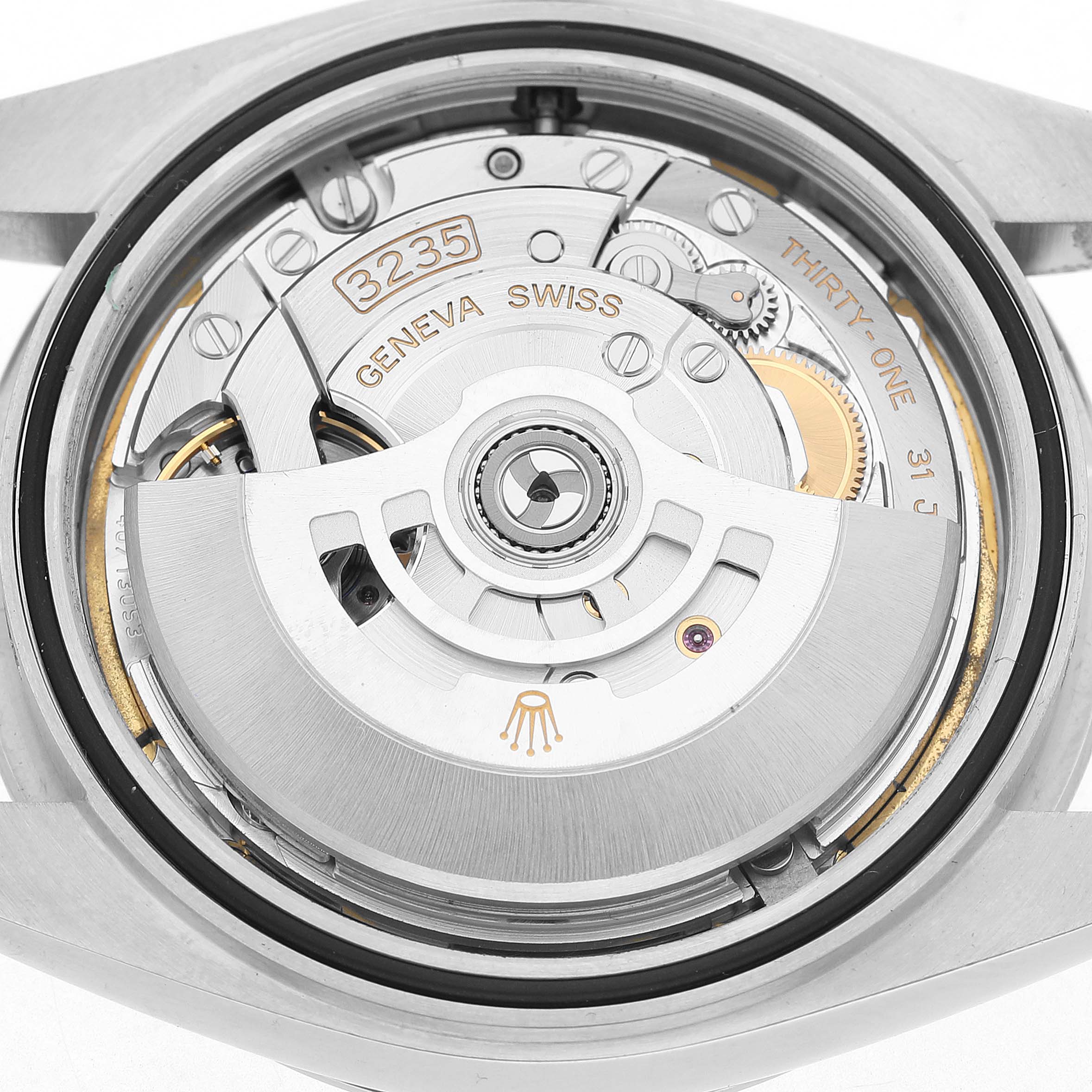 The image shows the movement of a Rolex Datejust 41 126300 Men's Stainless Steel White Dial from the back, highlighting the rotor and internal mechanics.