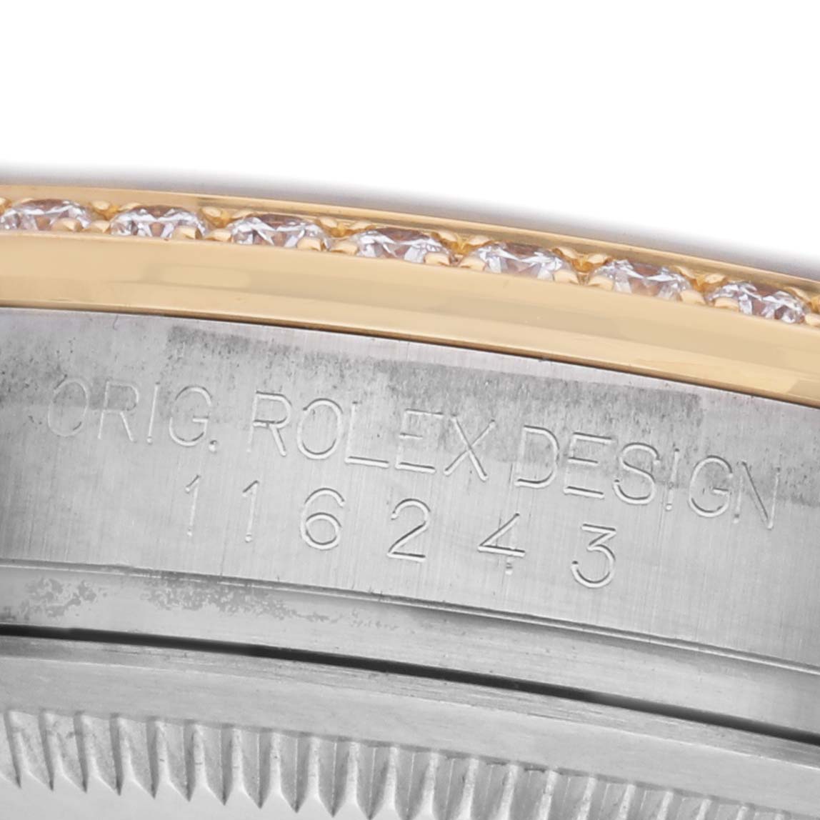 The image shows a close-up of the Rolex Datejust 116243 Men's Steel and Gold (two tone) Brown Dial model's engraved bezel with embedded diamonds and the design number.