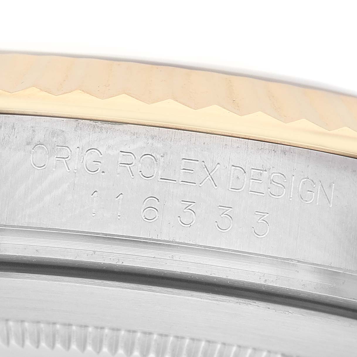 The image shows a close-up of the side of a Rolex Datejust 41 116333 Men's Steel and Gold (two tone) Grey Dial, highlighting the bezel and engraved model number.