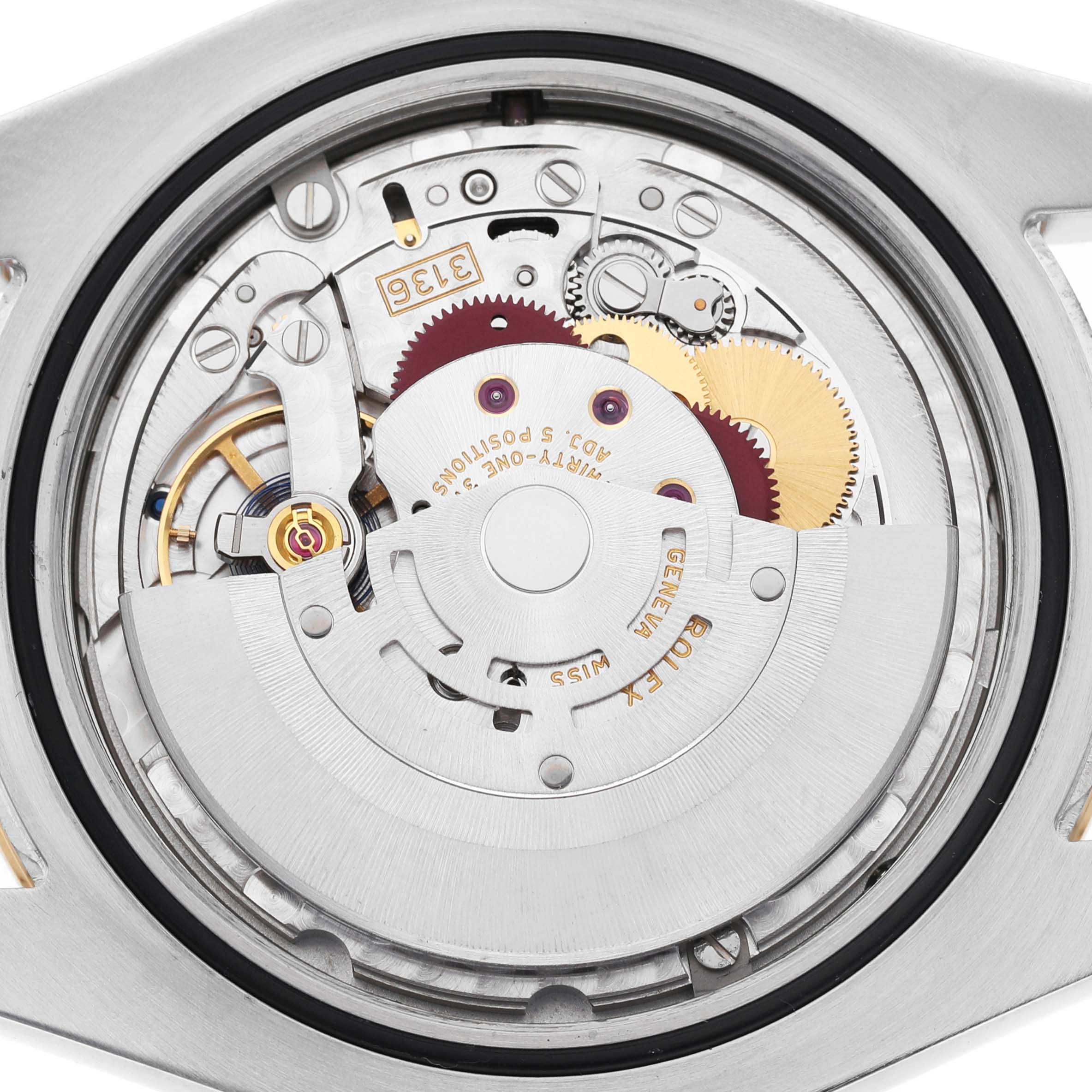 The image shows the movement of a Rolex Datejust 41 116333 Men's Steel and Gold (two tone) Grey Dial watch, highlighting its intricate gears and components from a top-down angle.