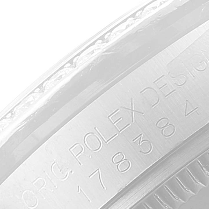 This image shows an angled close-up of the engraved side of a Rolex Mid-Size 178384 Women
s Stainless Steel Pink Dial 178384 Women
s Stainless Steel Pink Dial model watch.